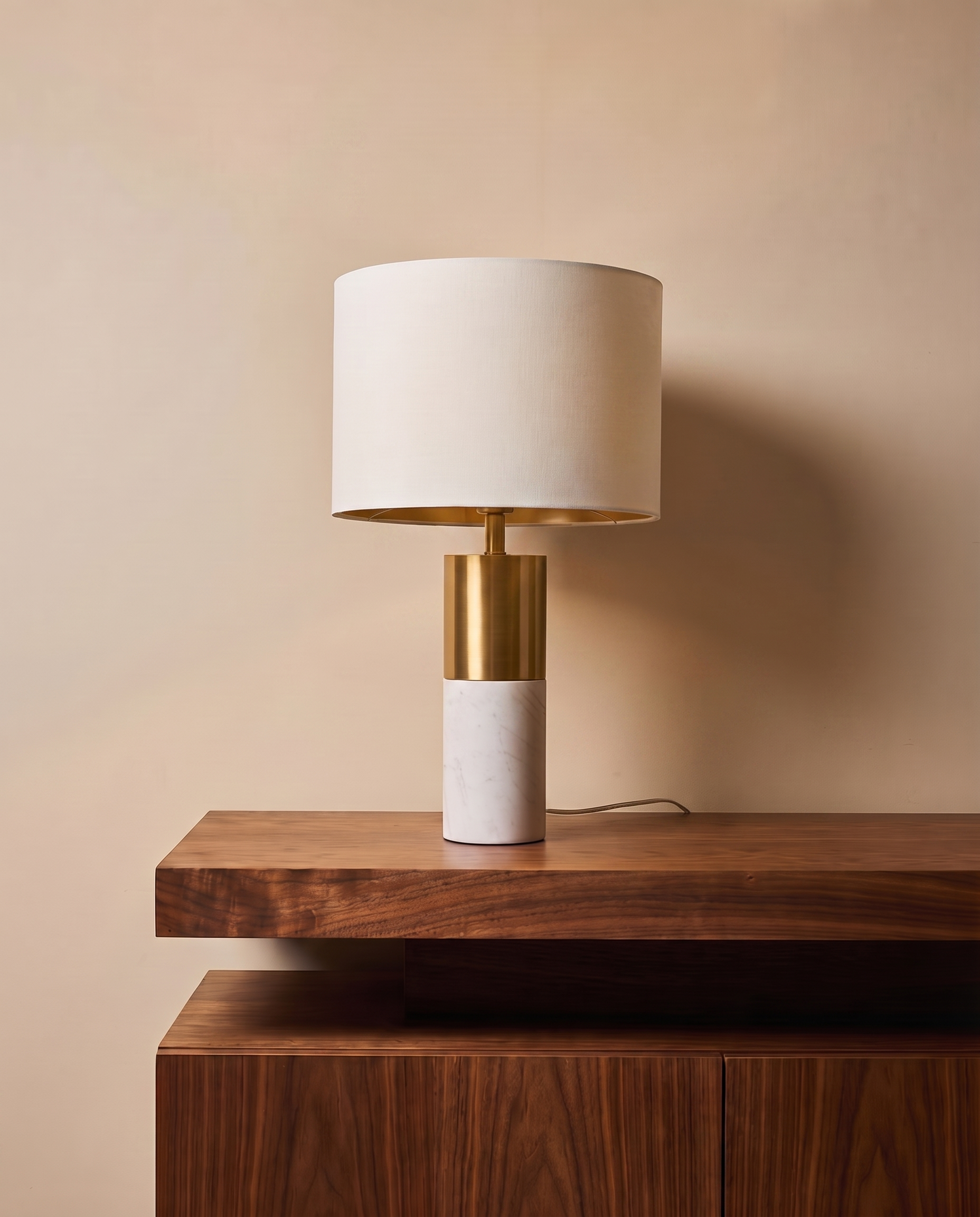 Gold and white table lamp with off-white shade