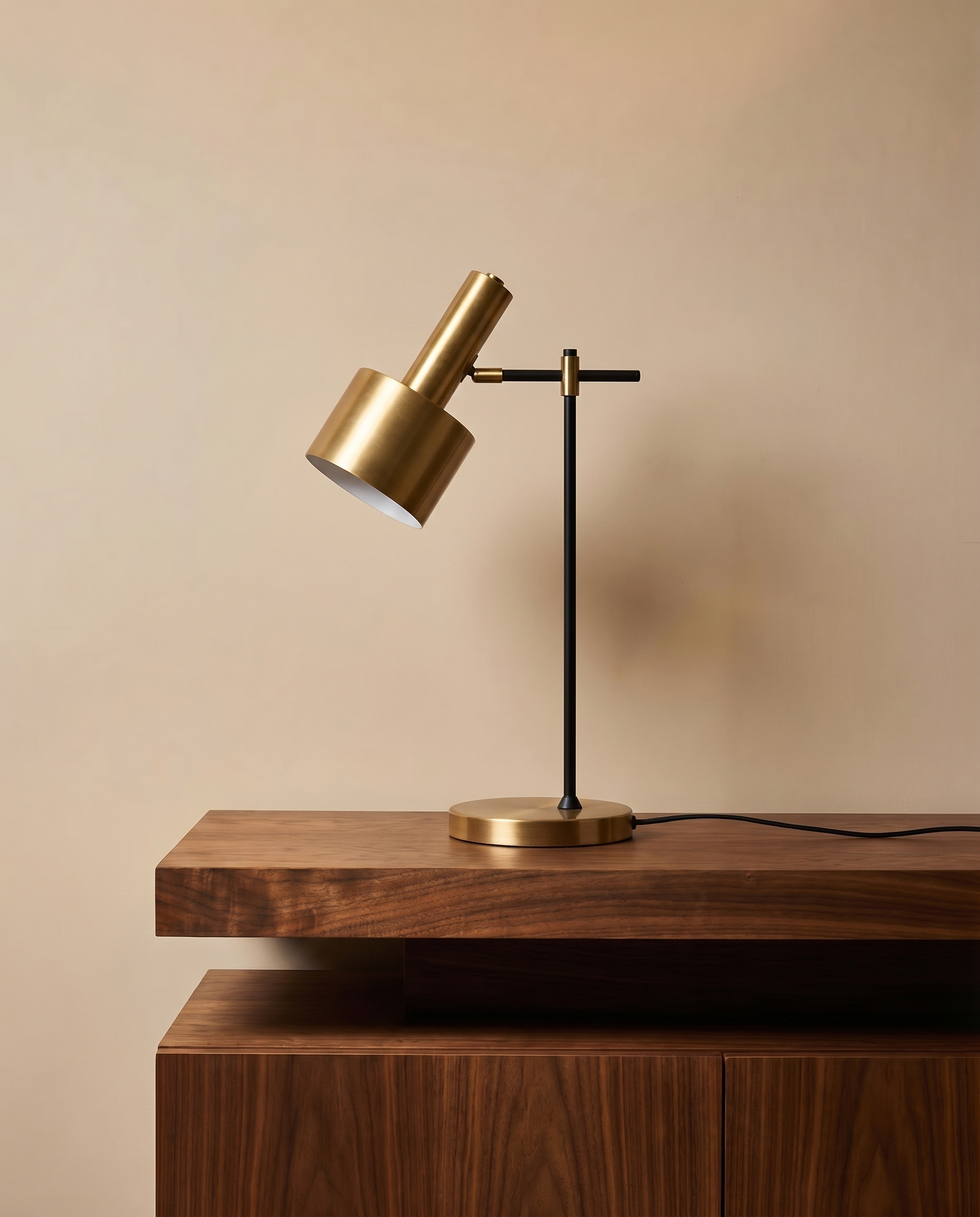 Adjustable gold and black table lamp