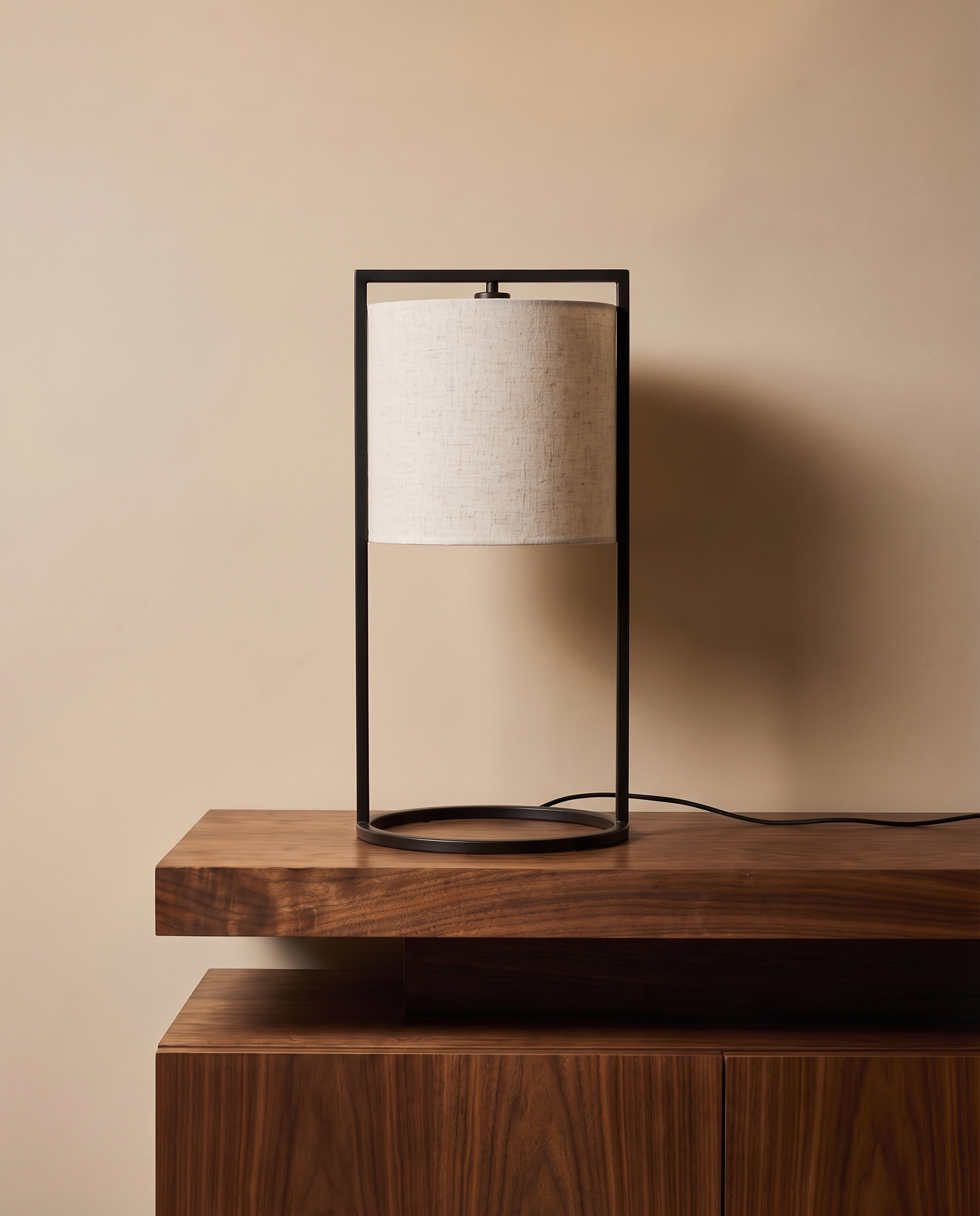 Large black table lamp with broad off-white shade
