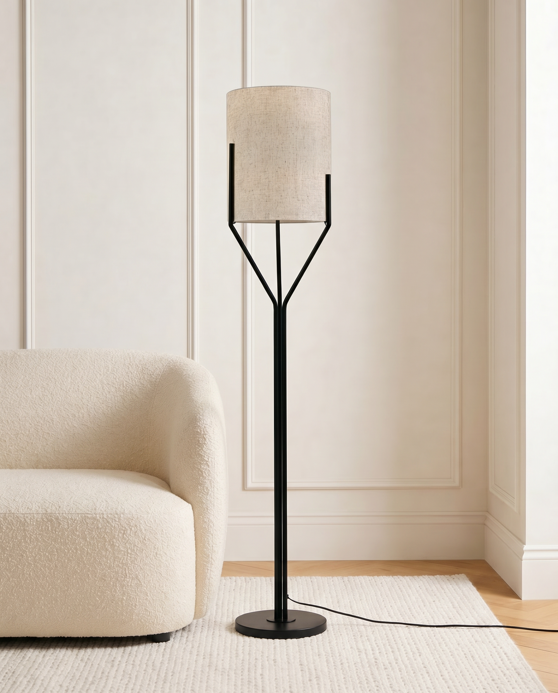 Black floor lamp with off-white fabric shade