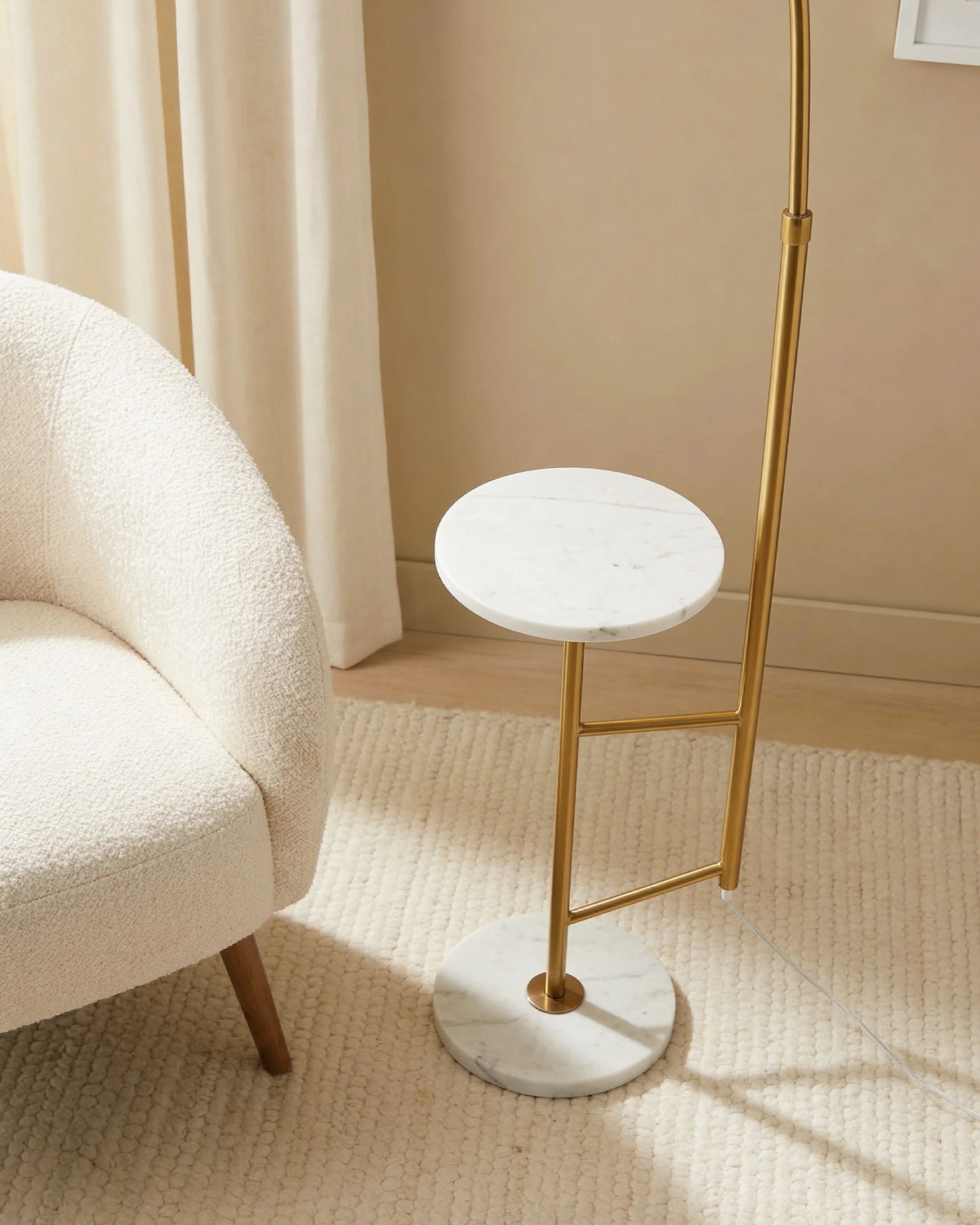Alsen gold arched floor lamp with marble table, close-up detail