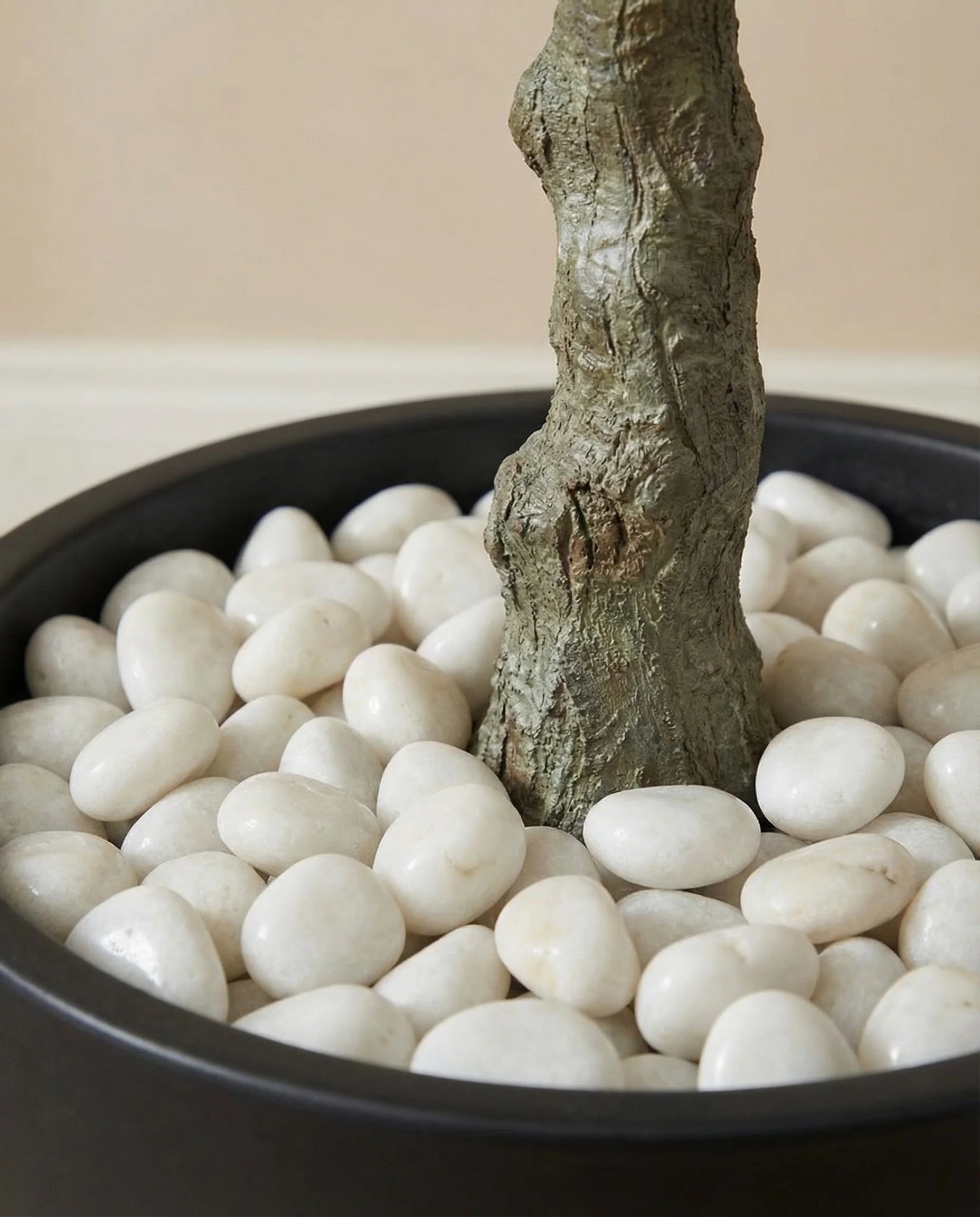 Rustic artificial olive tree with olives in a Dubai living room