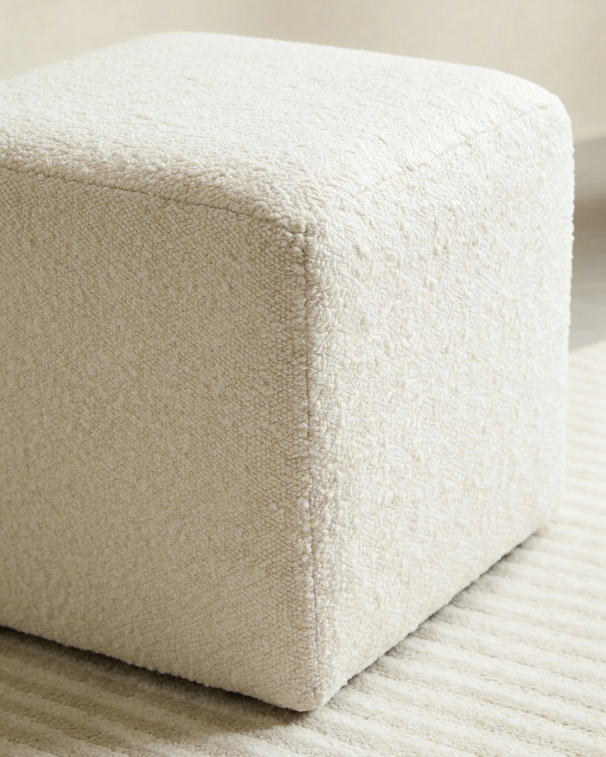 Bouclé cube pouf, close-up of the fabric