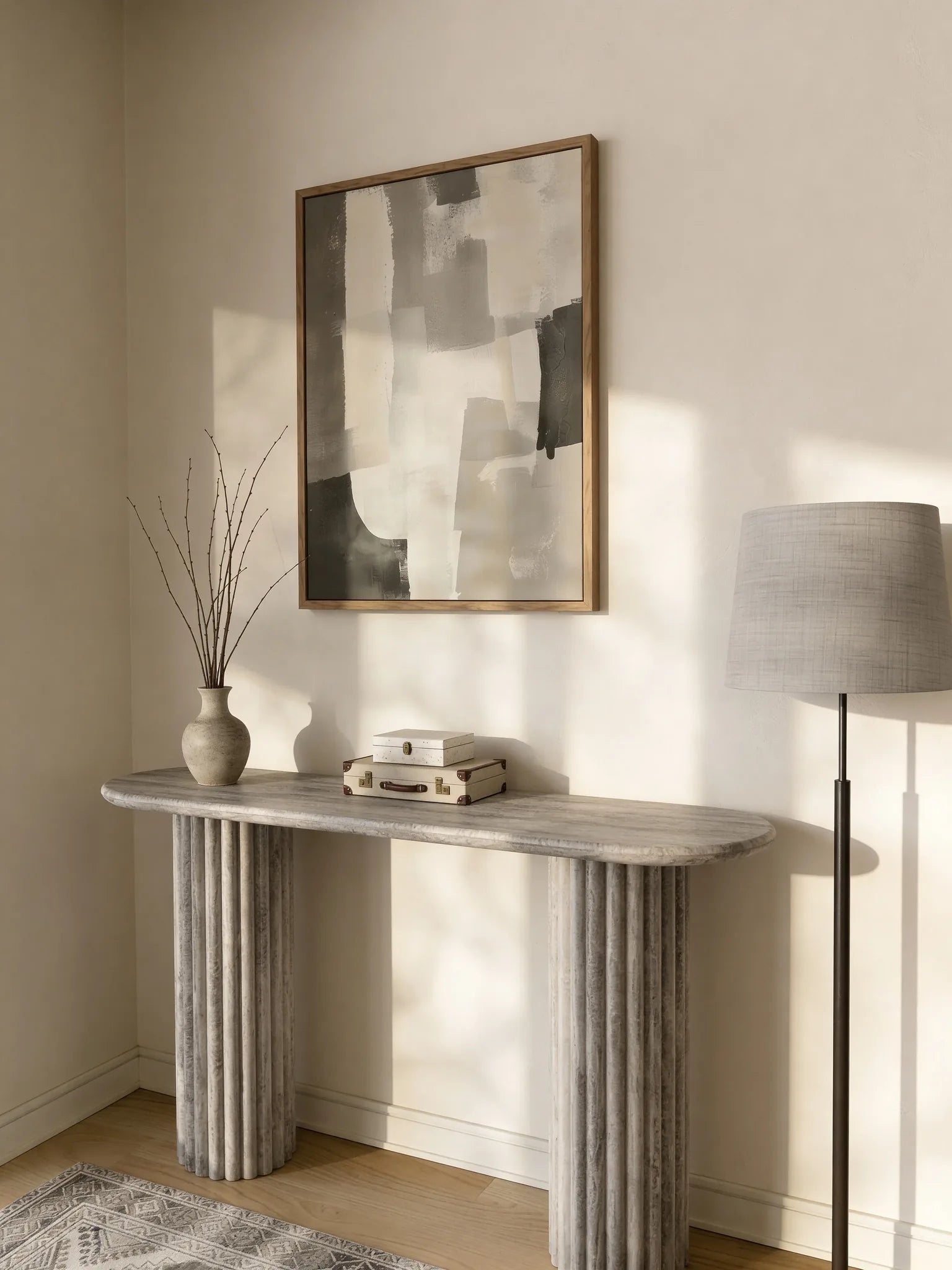 Grey travertine console table, close-up of the fluted base