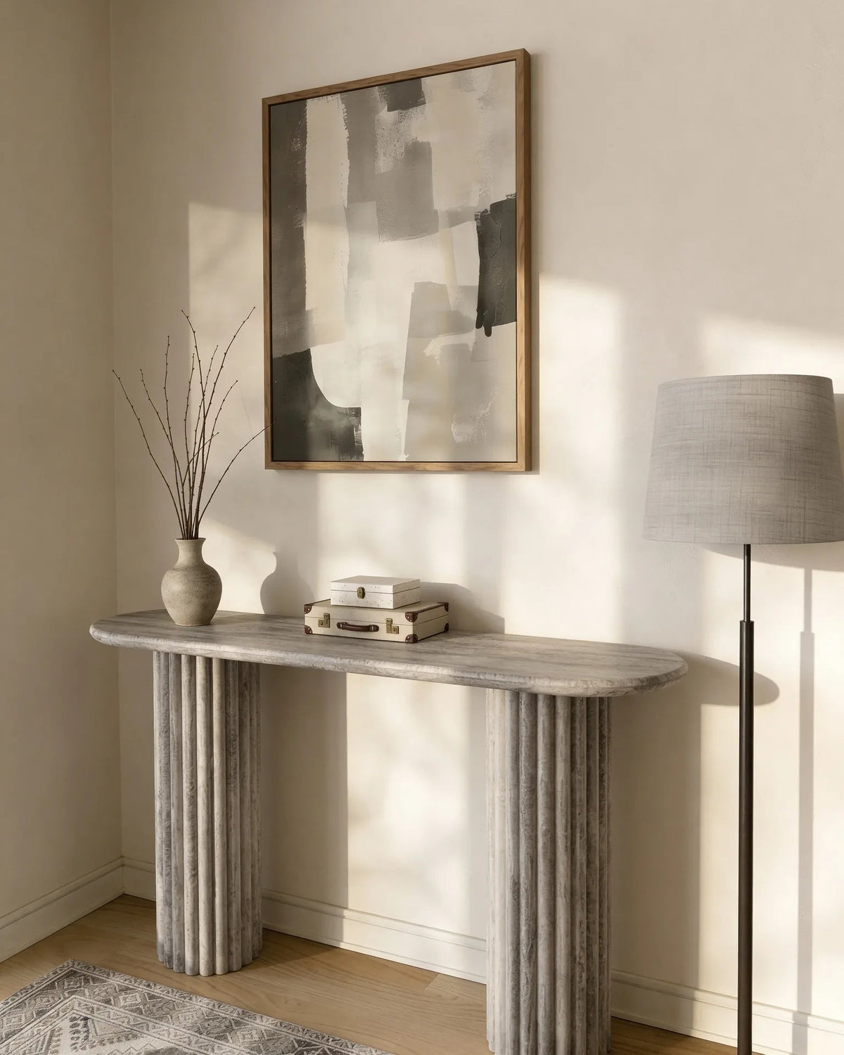 Grey travertine console table, close-up of the fluted base