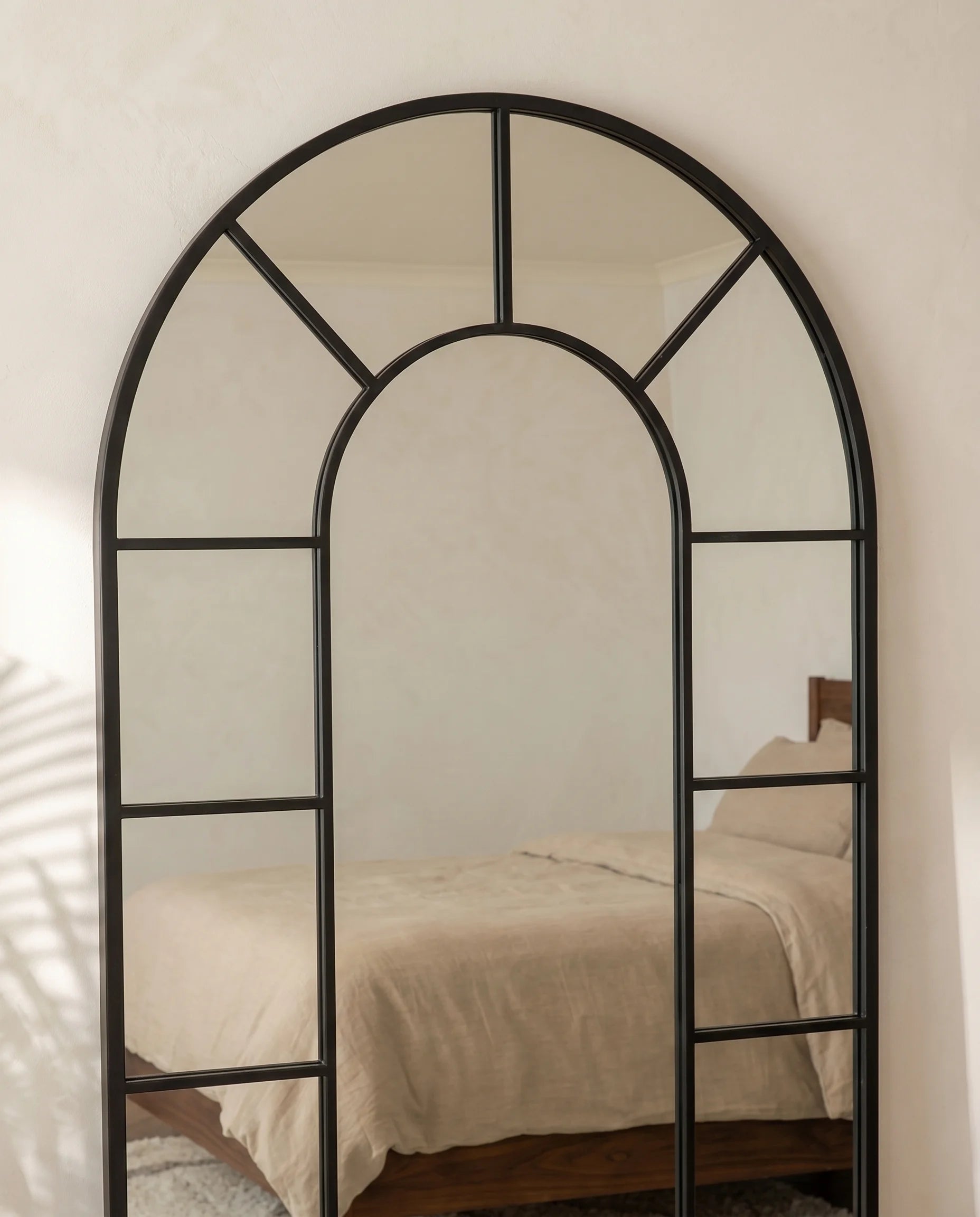 Charles black window-pane arch mirror, close-up of the grid frame