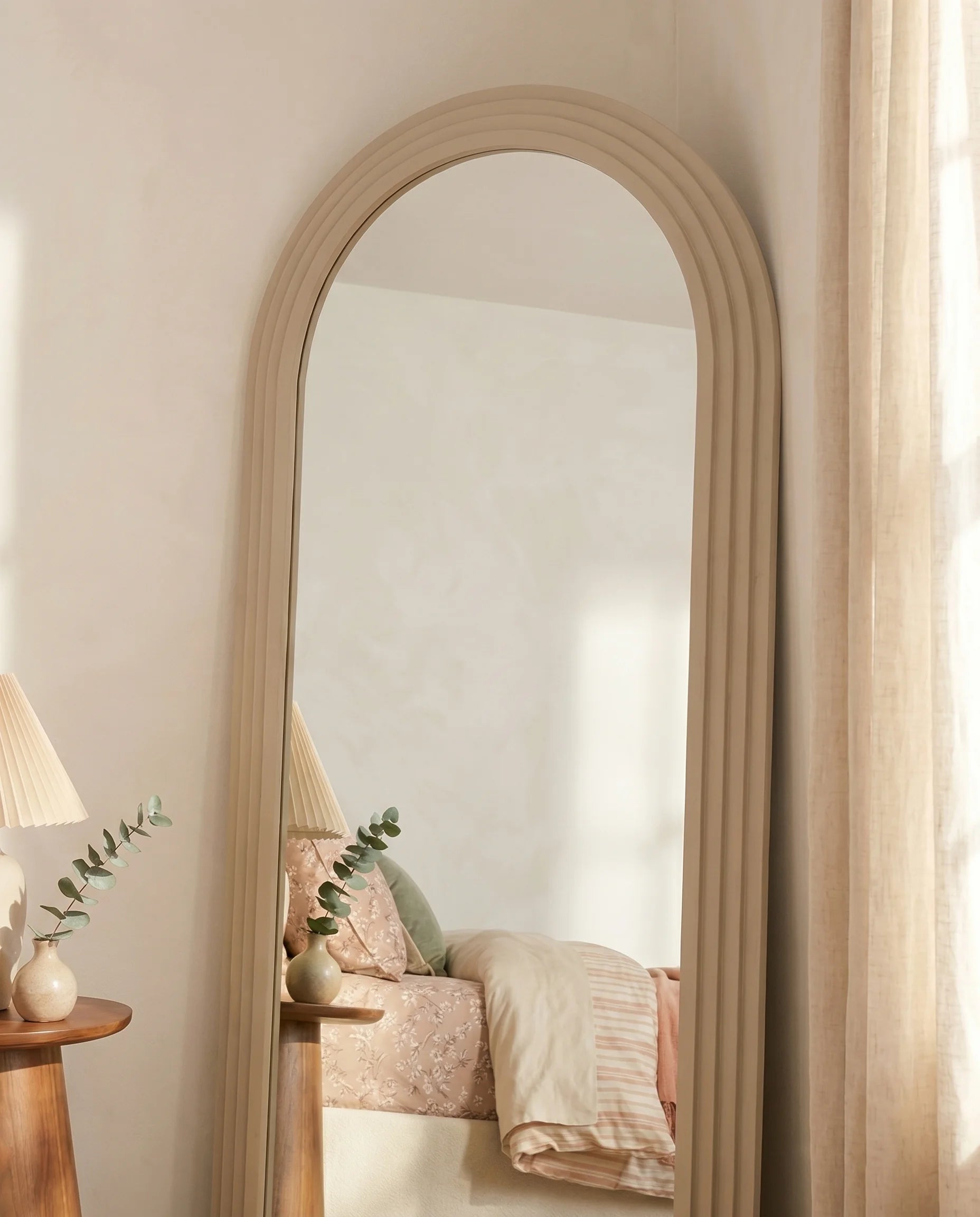 Charlotte arched full-length mirror, close-up of the wood-look frame