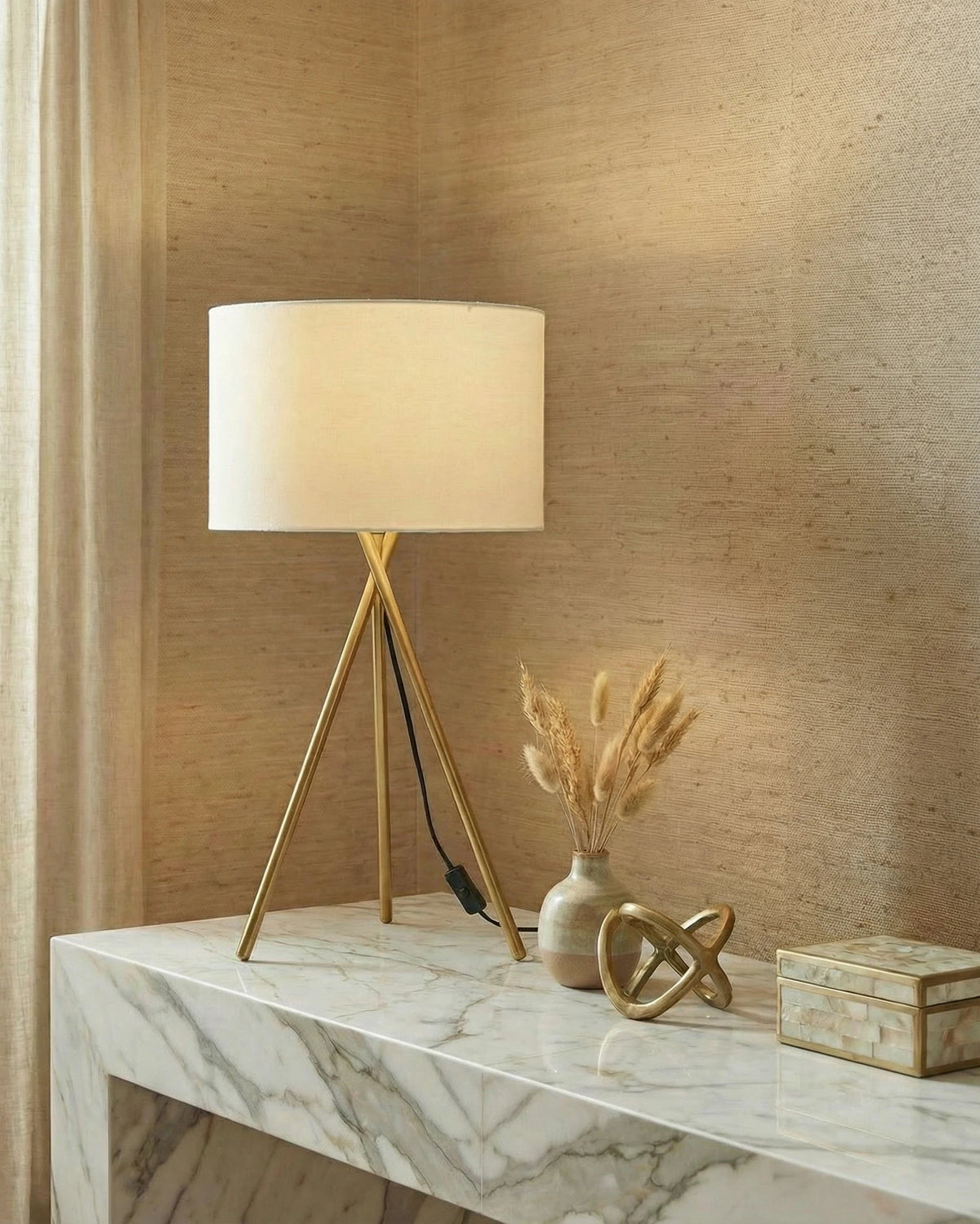 Dante gold tripod table lamp with a fabric shade