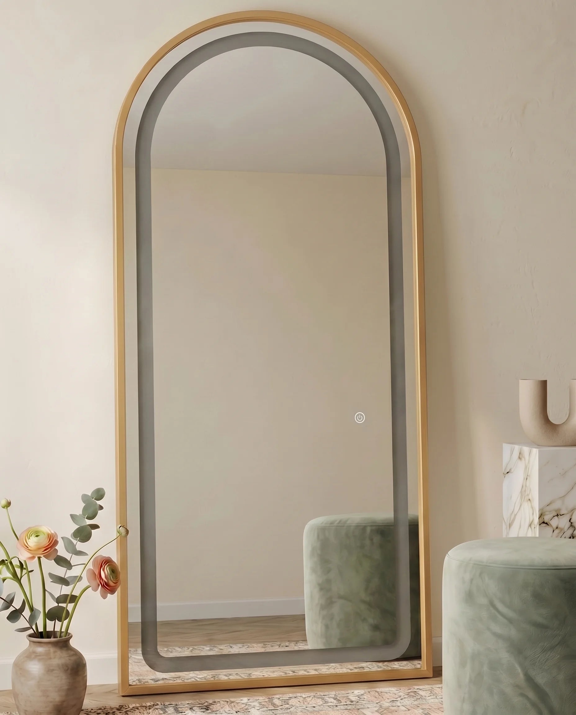 Diana gold LED arched mirror, close-up of the lit frame