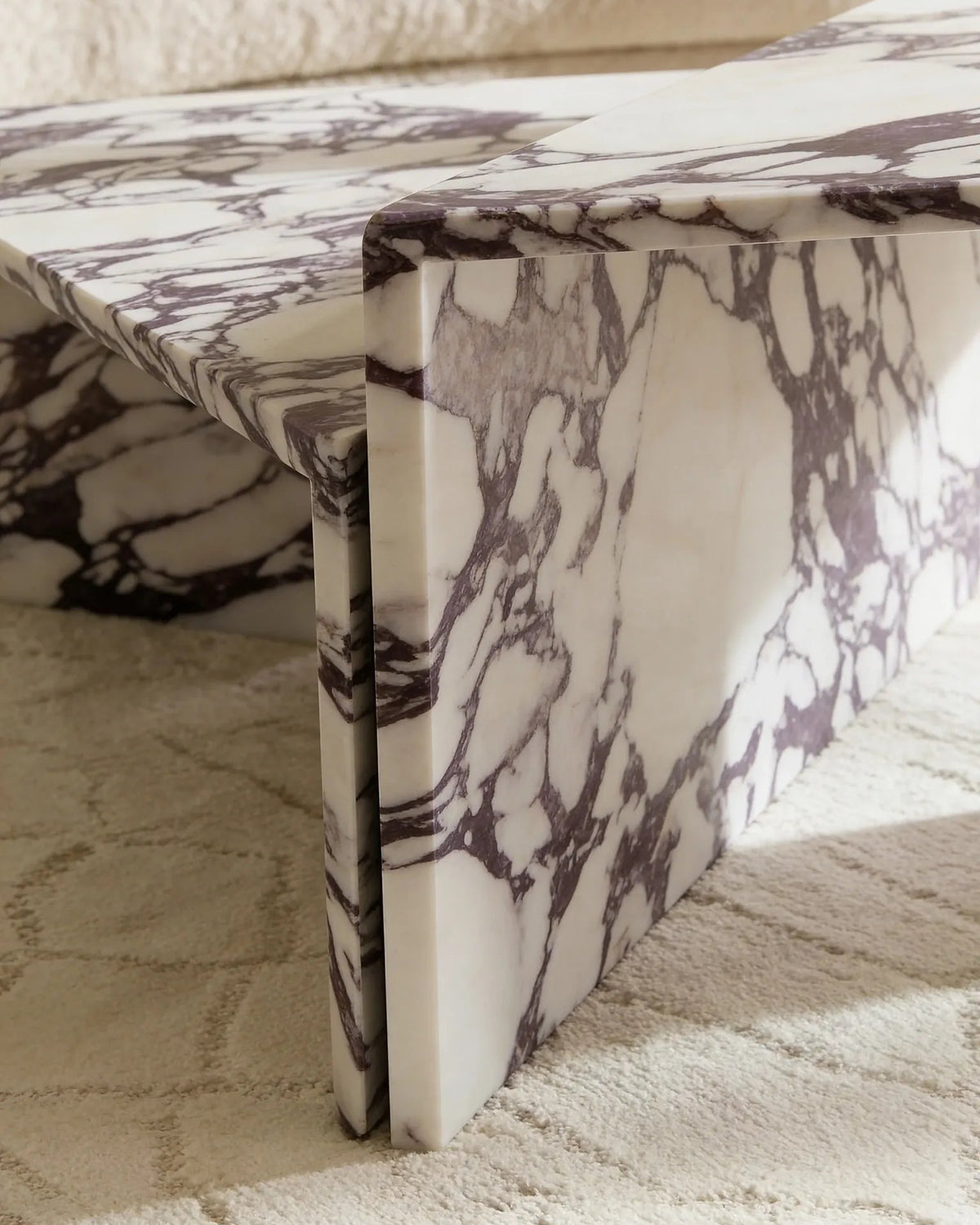 Free-form Calacatta Viola coffee table in a Dubai living room