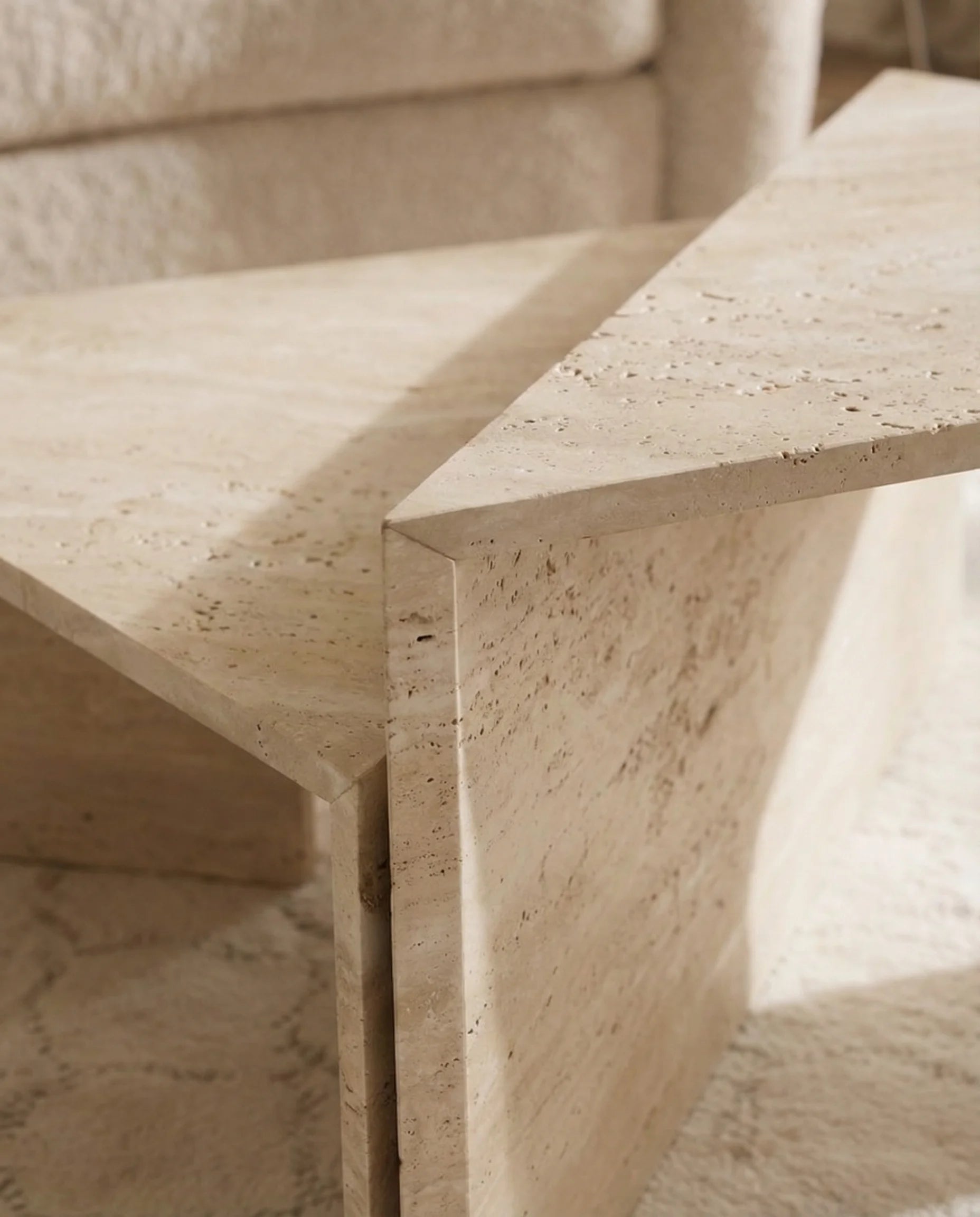 Free-form travertine coffee table in a Dubai living room