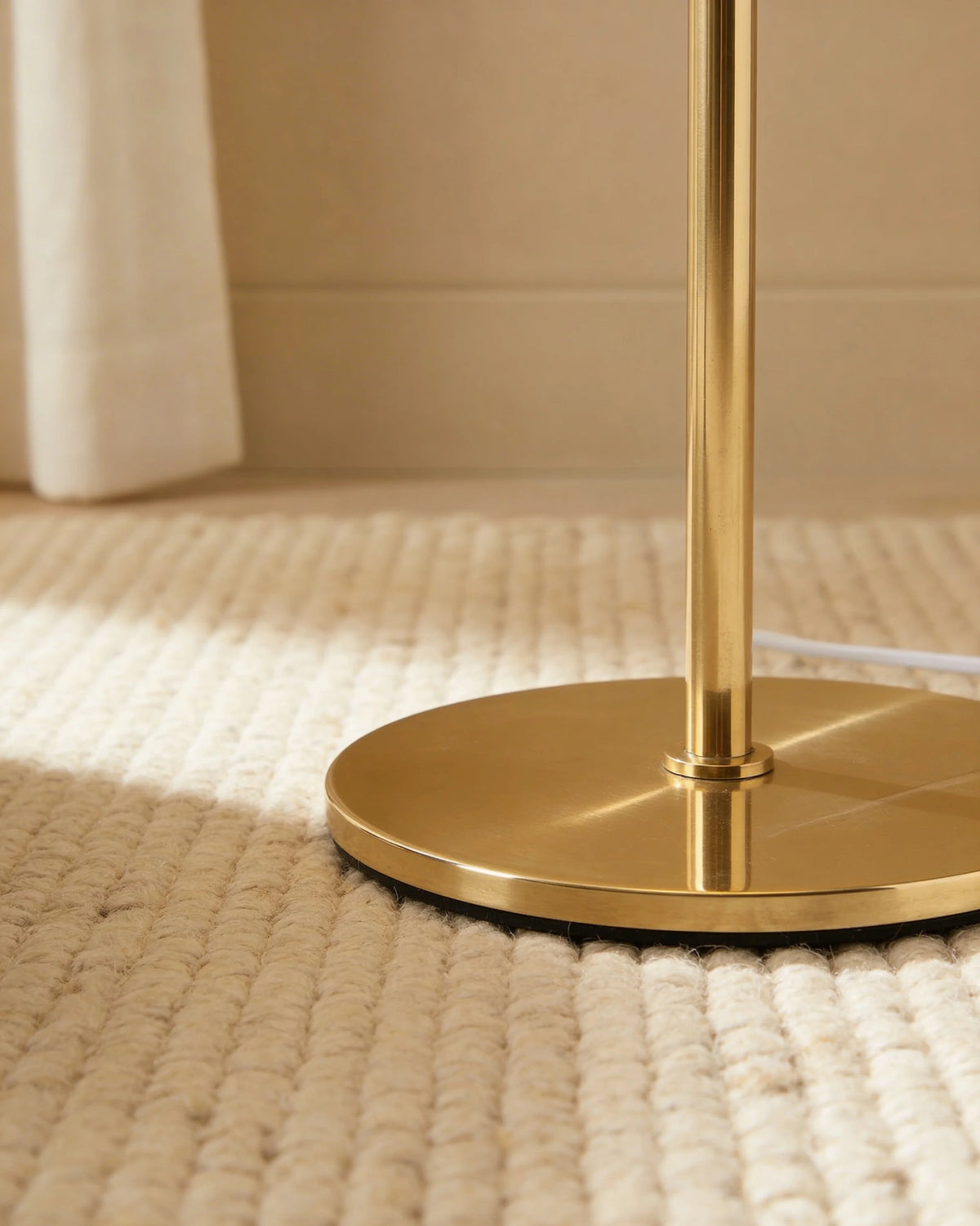 Glowing orb gold floor lamp, close-up detail