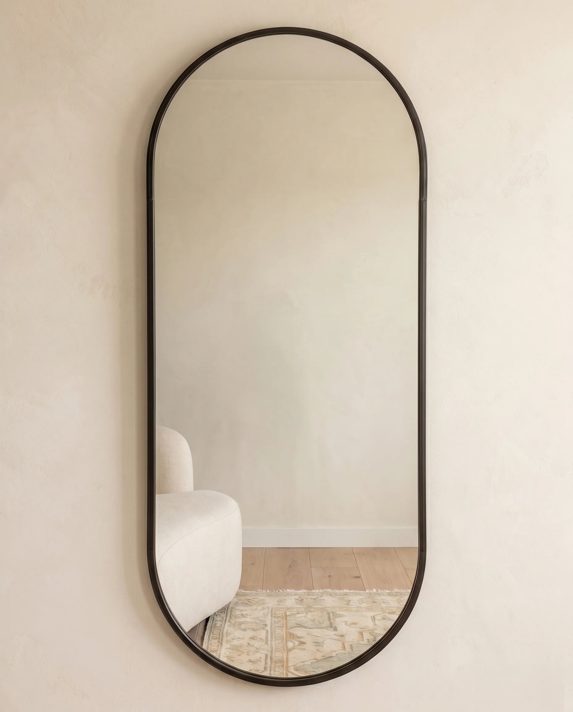 Gothic black framed capsule wall mirror