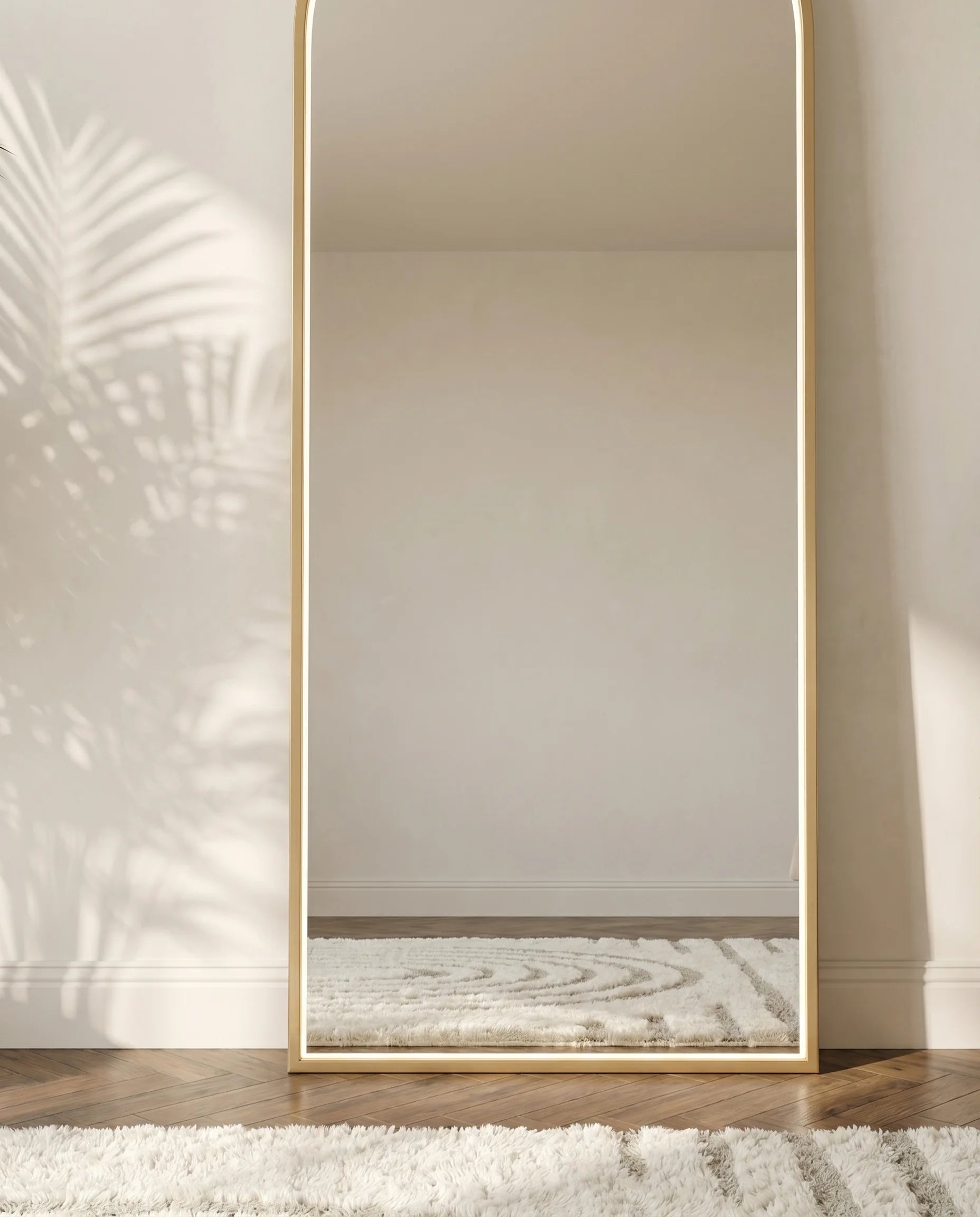 Iris gold LED arch mirror, close-up of the touch light control