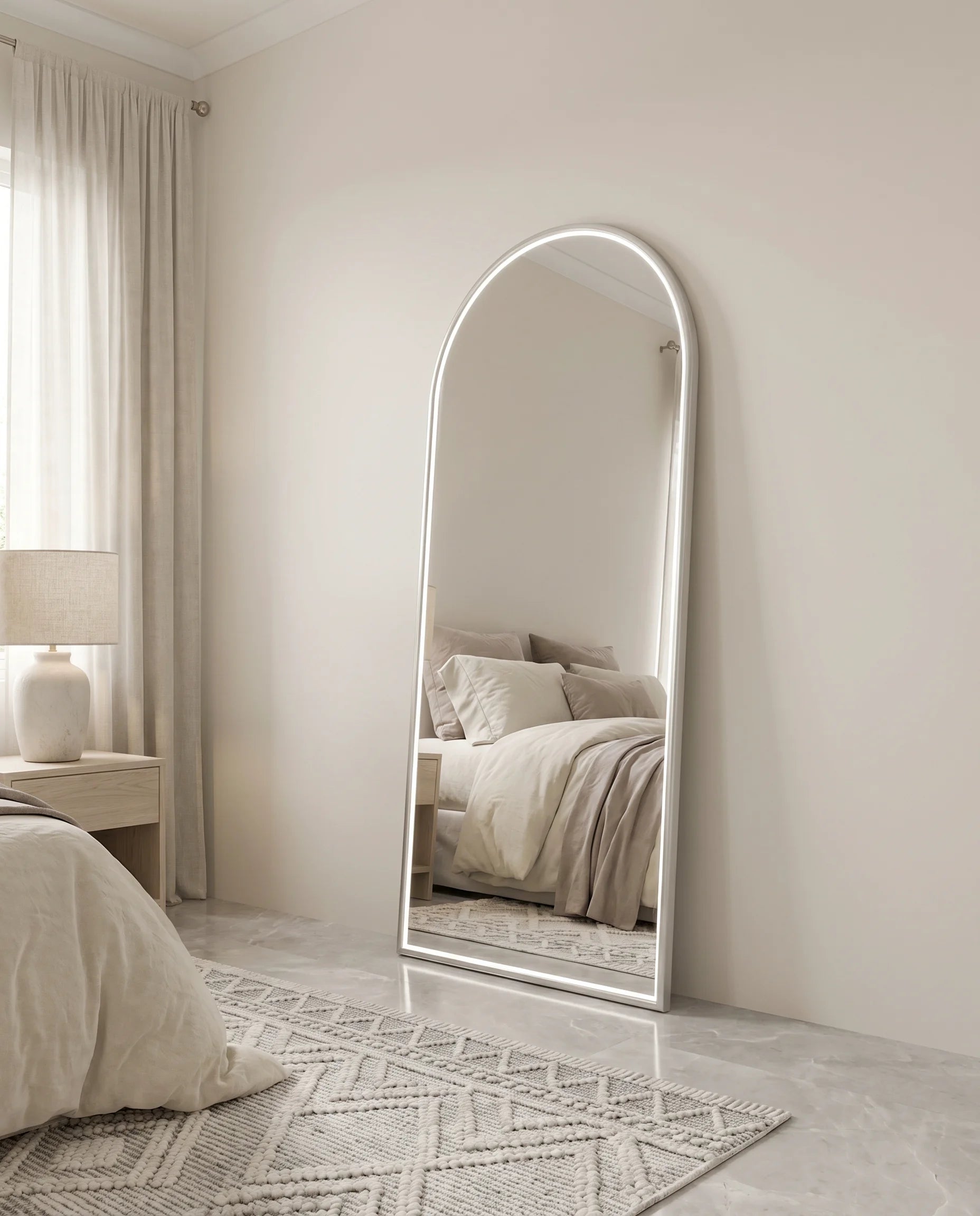 Iris silver LED arch mirror in a Dubai bathroom