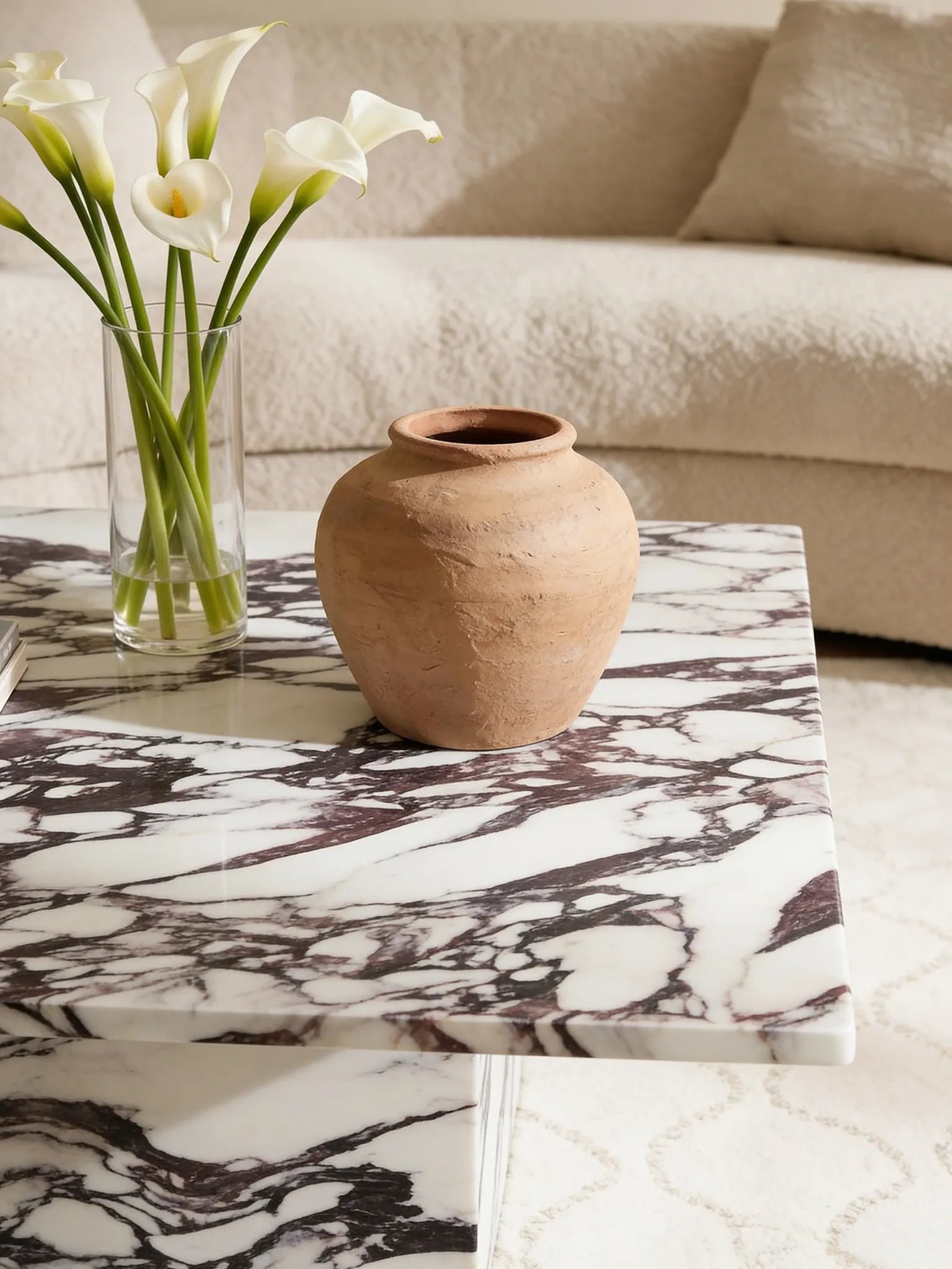 Square Calacatta Viola marble coffee table in a Dubai living room