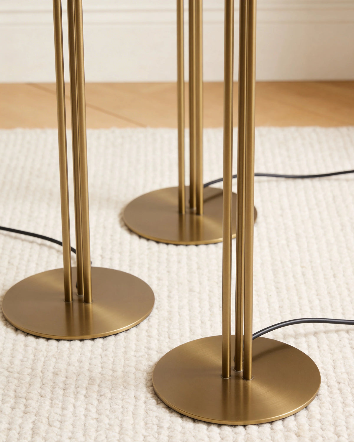 Ivory and gold torch floor lamp trio, close-up detail
