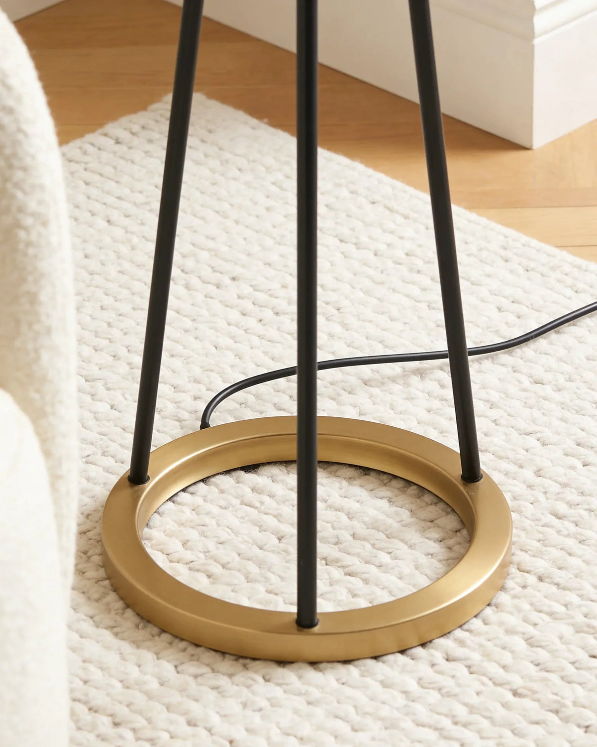 Janice black and gold tripod floor lamp, close-up detail