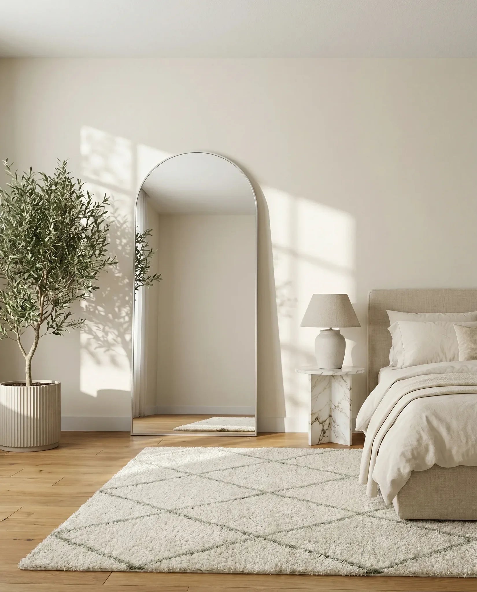Juliette tall silver framed arch mirror in a Dubai entryway