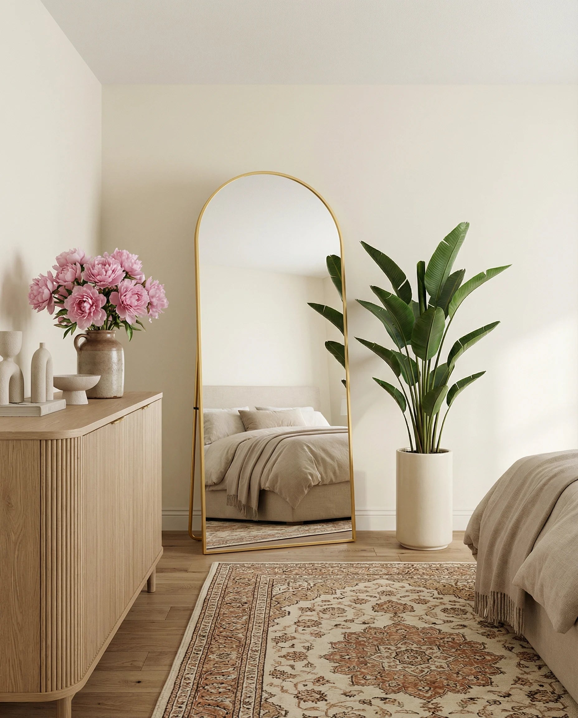 Juliette tall gold arch standing mirror in a Dubai bedroom