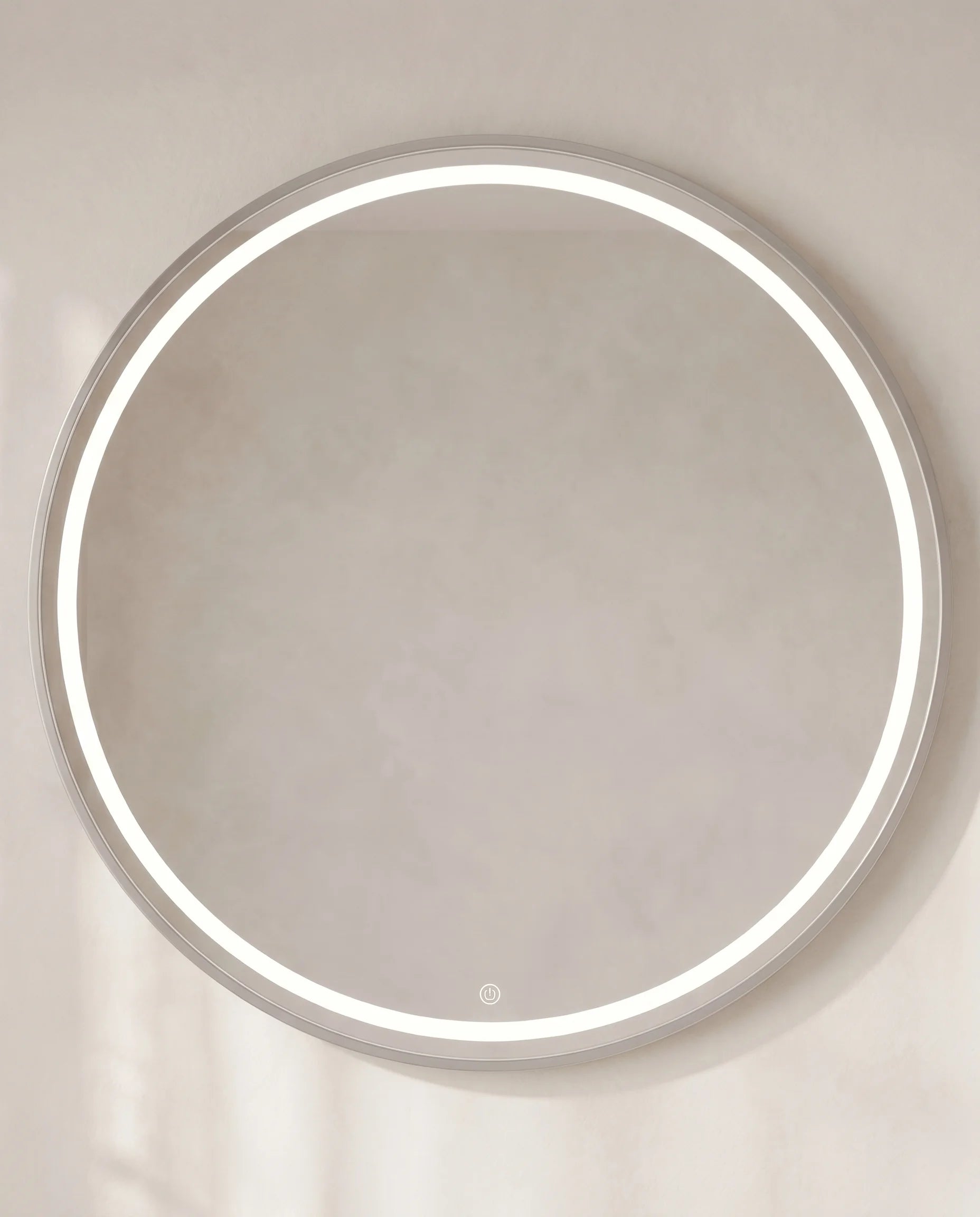 Lavish silver LED round mirror, close-up of the touch light