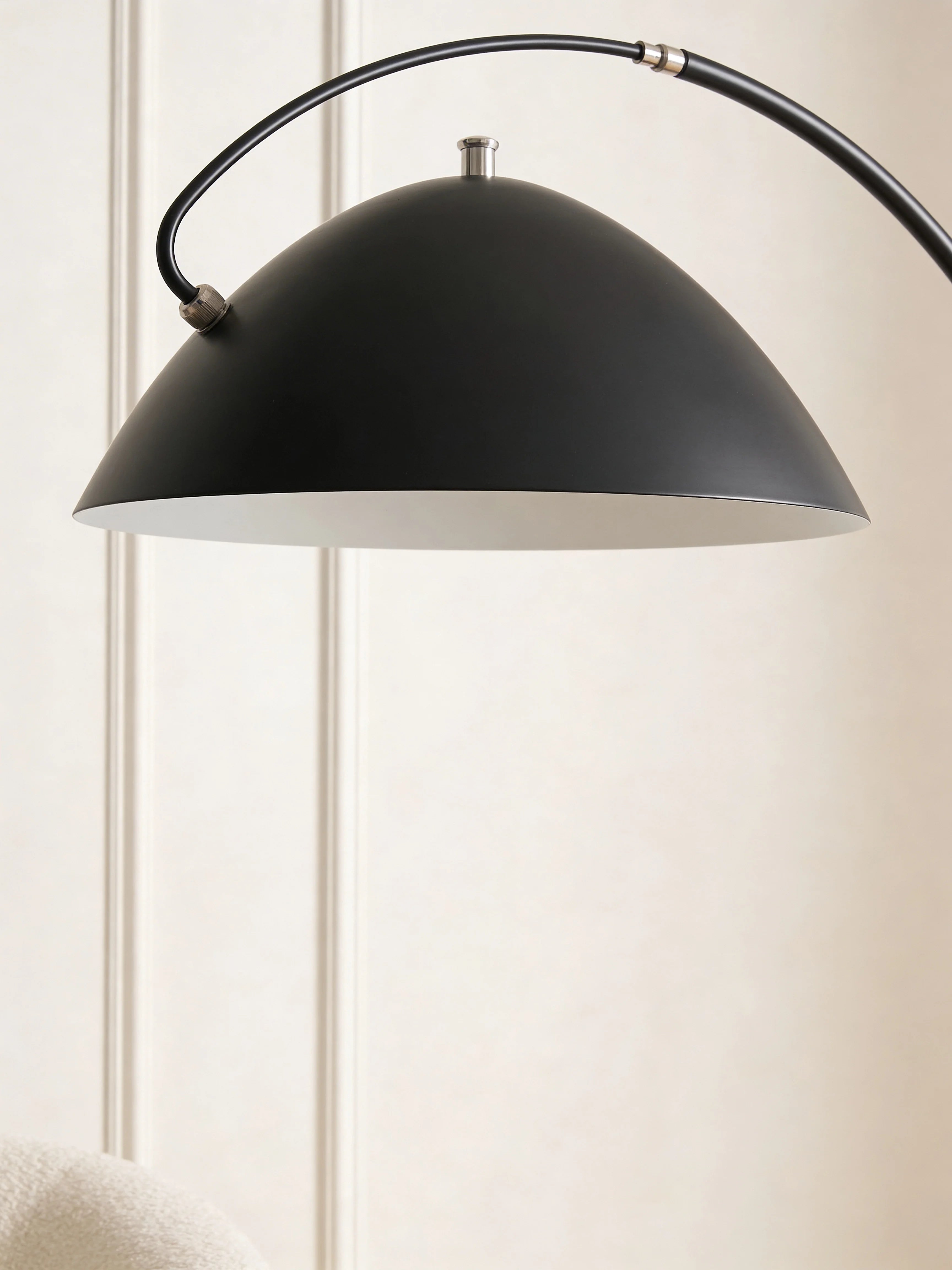 Mid-century black floor lamp in a Dubai living room