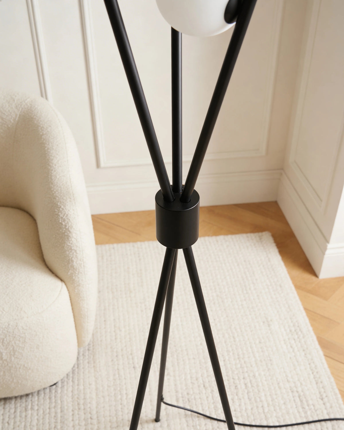 Luna black tripod floor lamp with marble shades, close-up detail