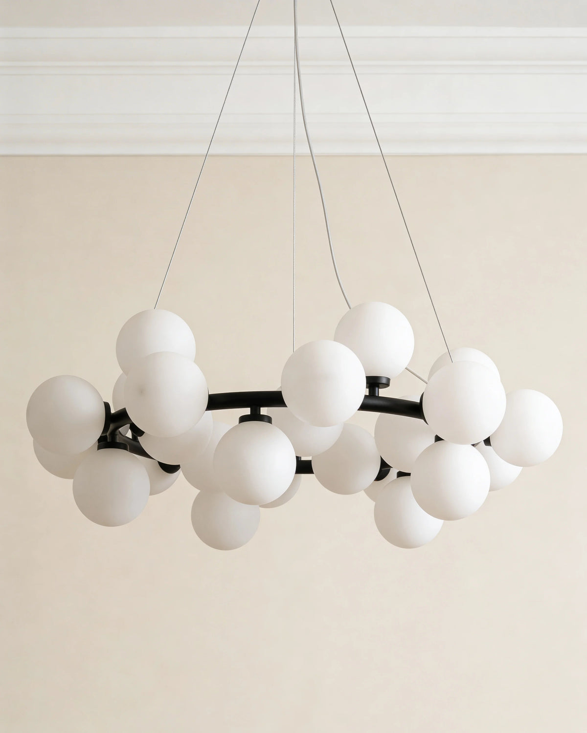 Glass globe chandelier in a Dubai dining room