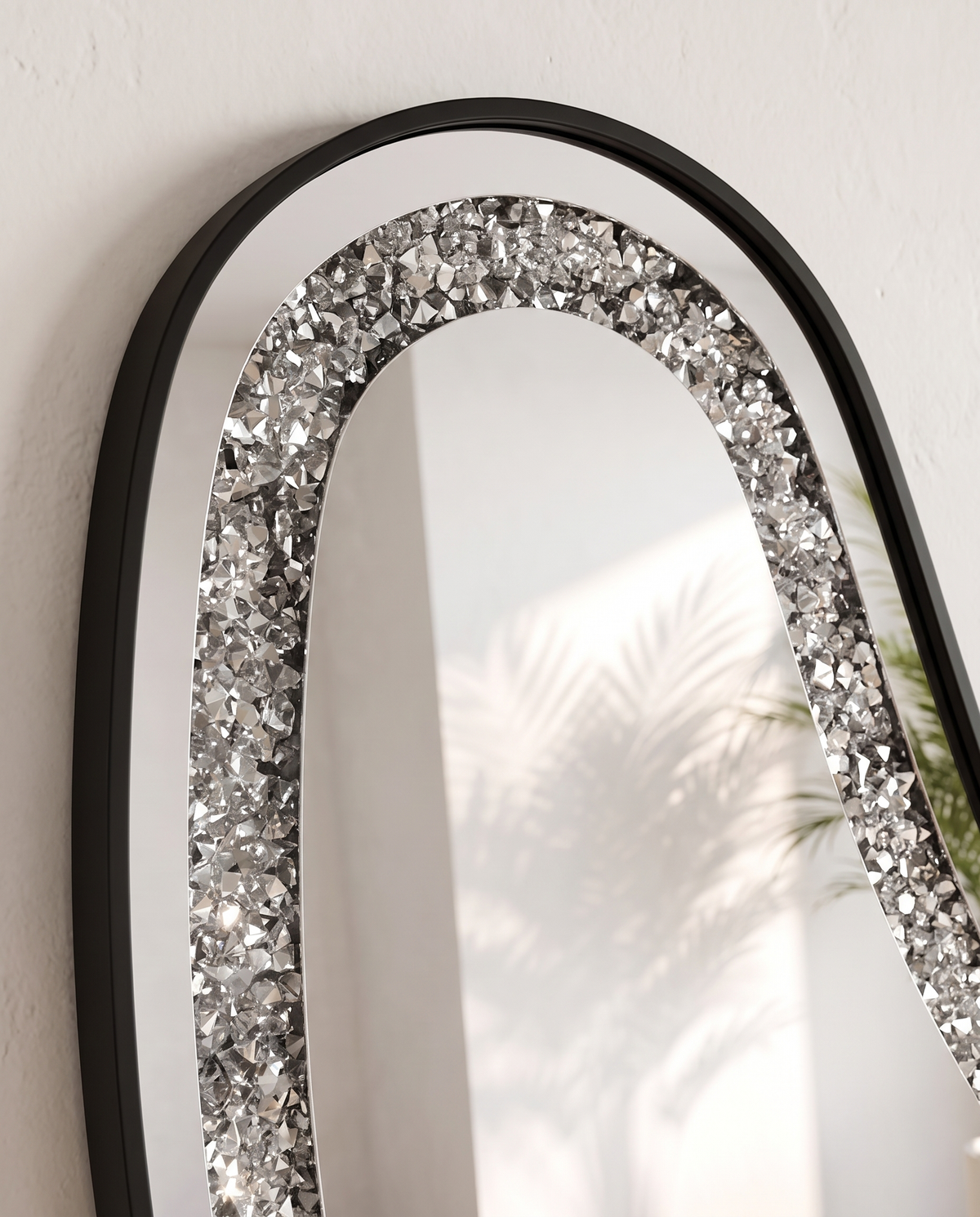 Almas Black Frame LED Irregular Mirror leaning against a cream wall, The Home Peck