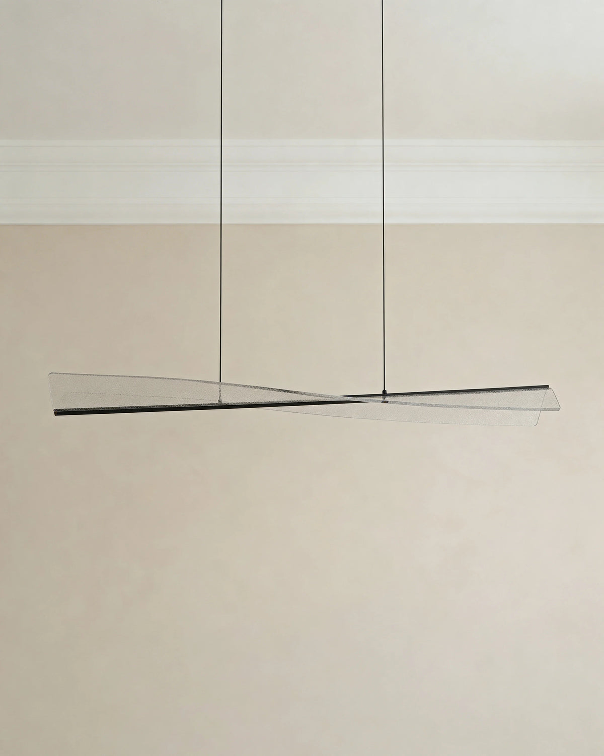 Curved LED island light over a Dubai kitchen