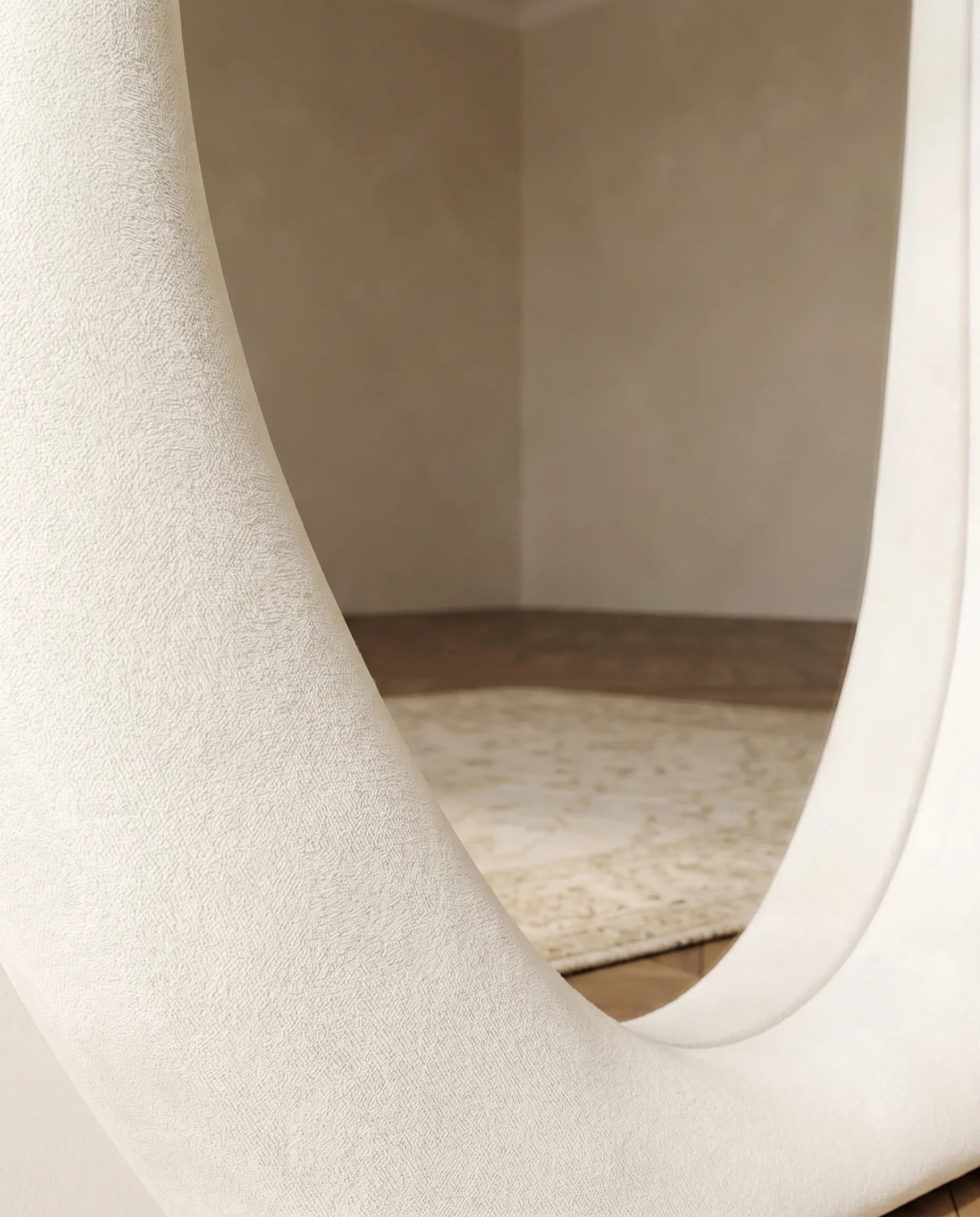 Mina white funky wall mirror, close-up of the soft fabric frame