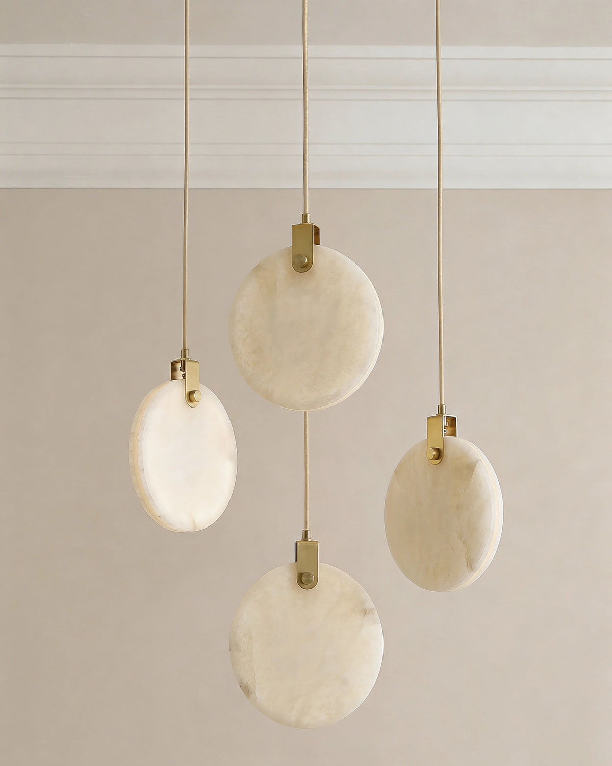 Disc pendant light over a Dubai dining table