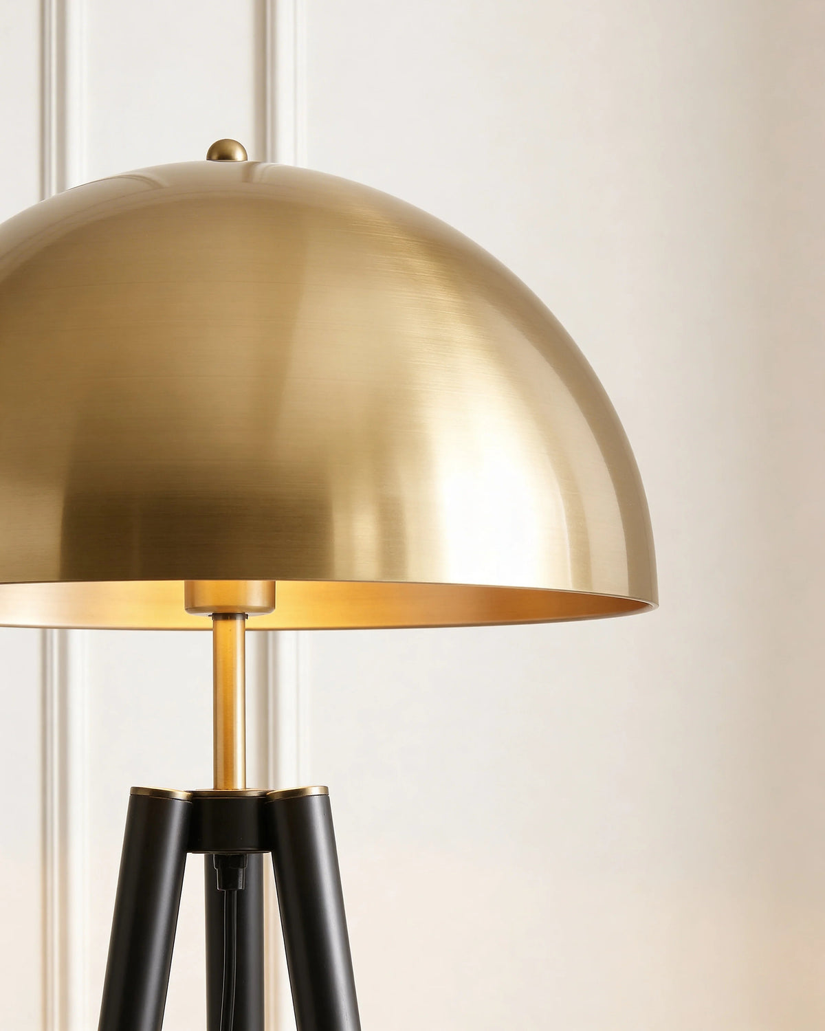 Brass tripod floor lamp in a Dubai living room