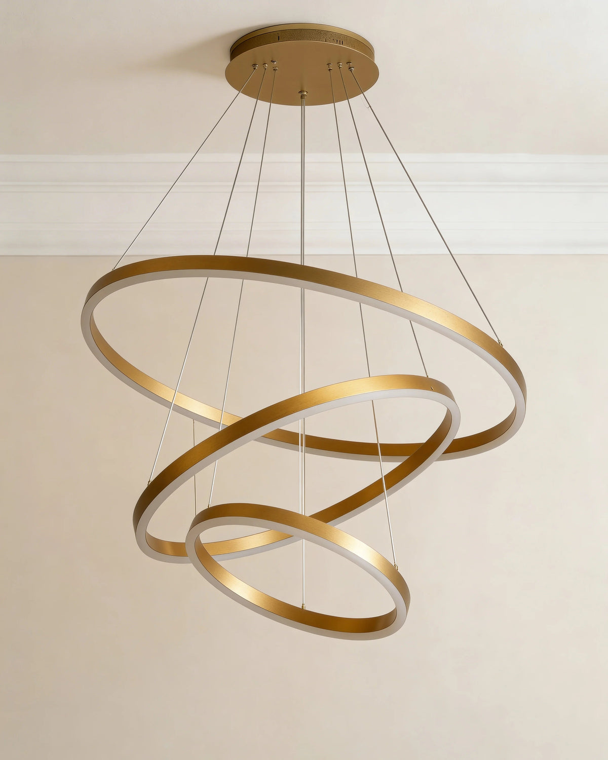 Gold ring chandelier over a Dubai dining table