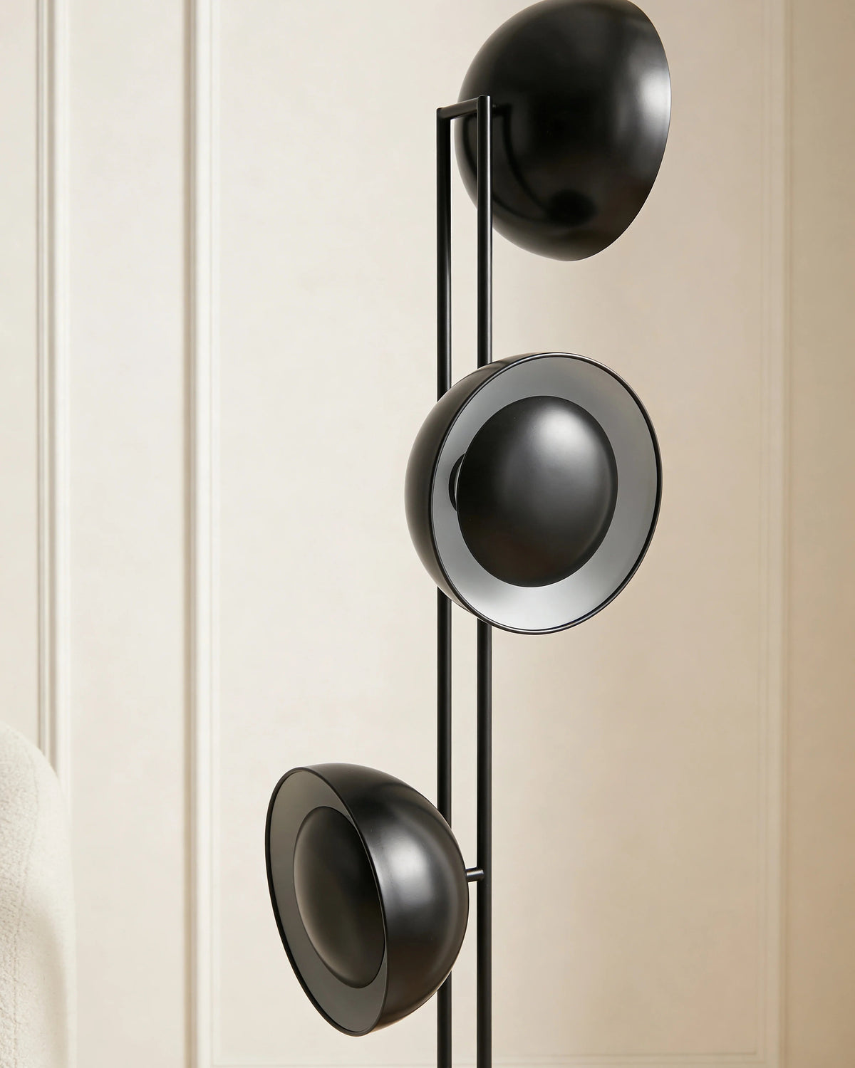 Black sphere floor lamp in a Dubai living room