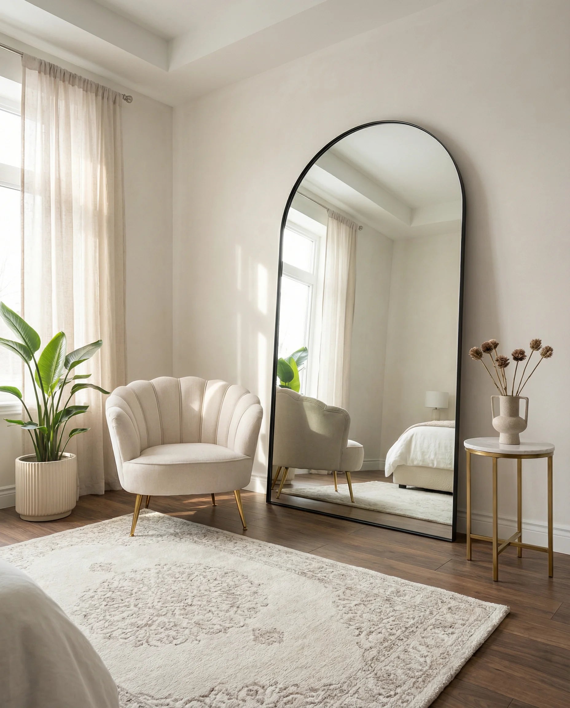 Raphael large black arched wall mirror in a Dubai living room