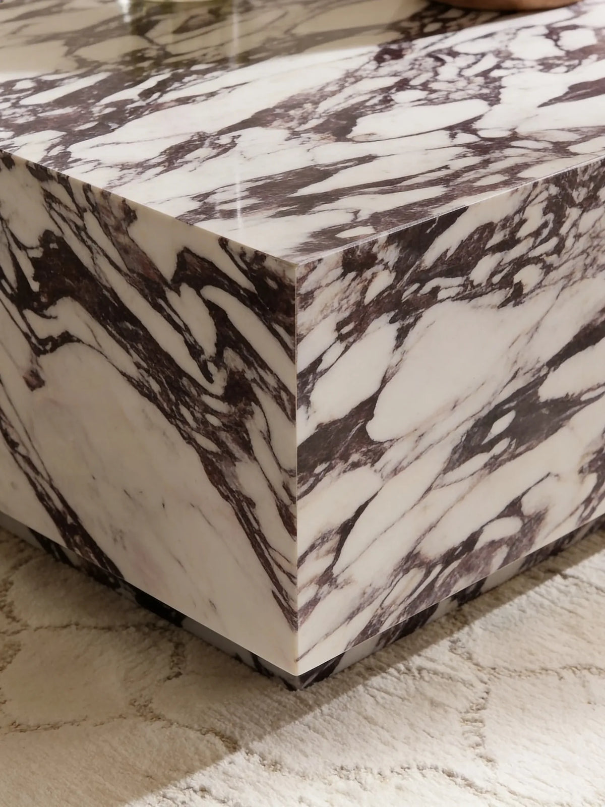 Square Calacatta Viola marble coffee table in a Dubai living room