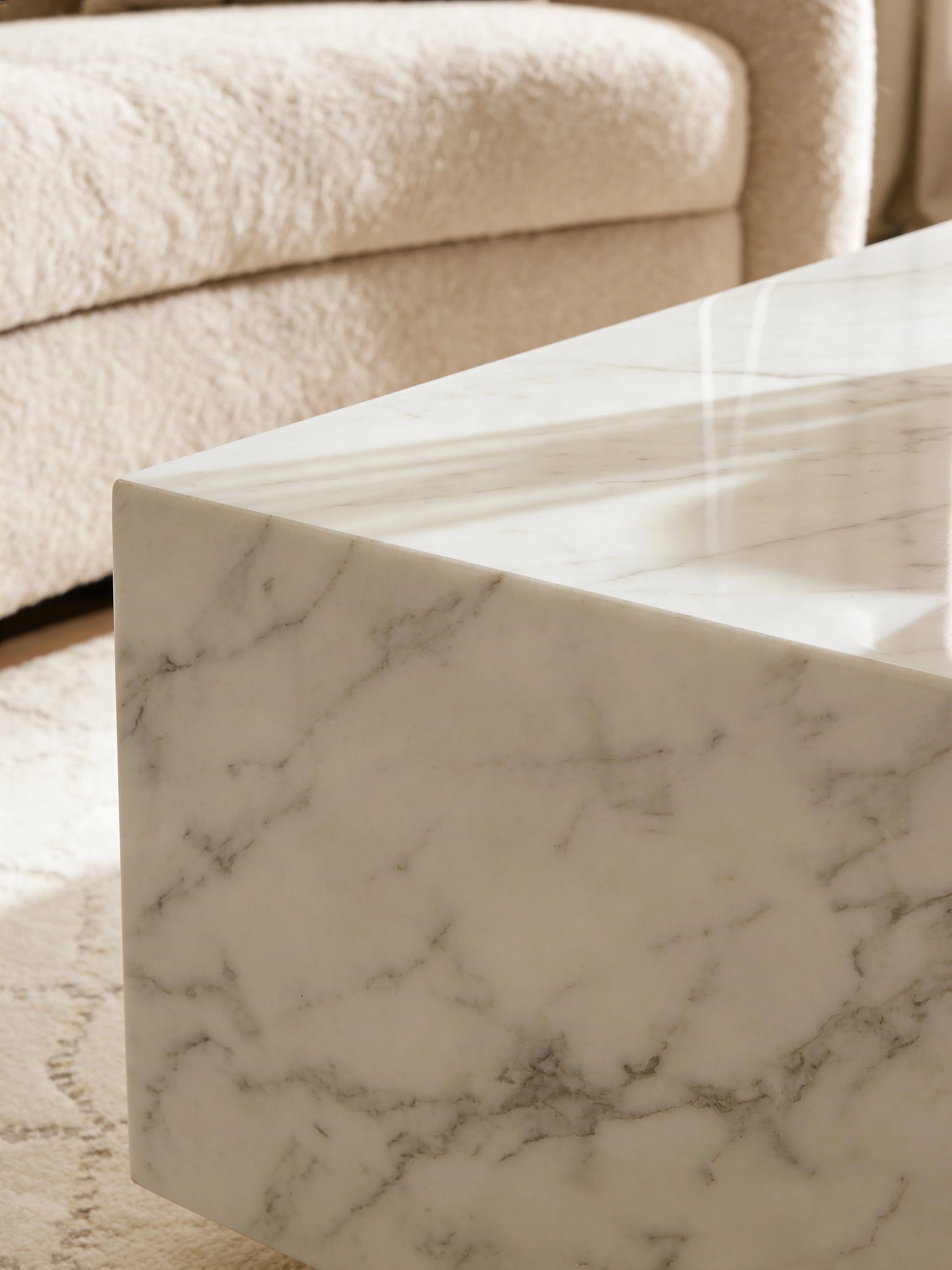 Square Carrara marble coffee table in a Dubai living room