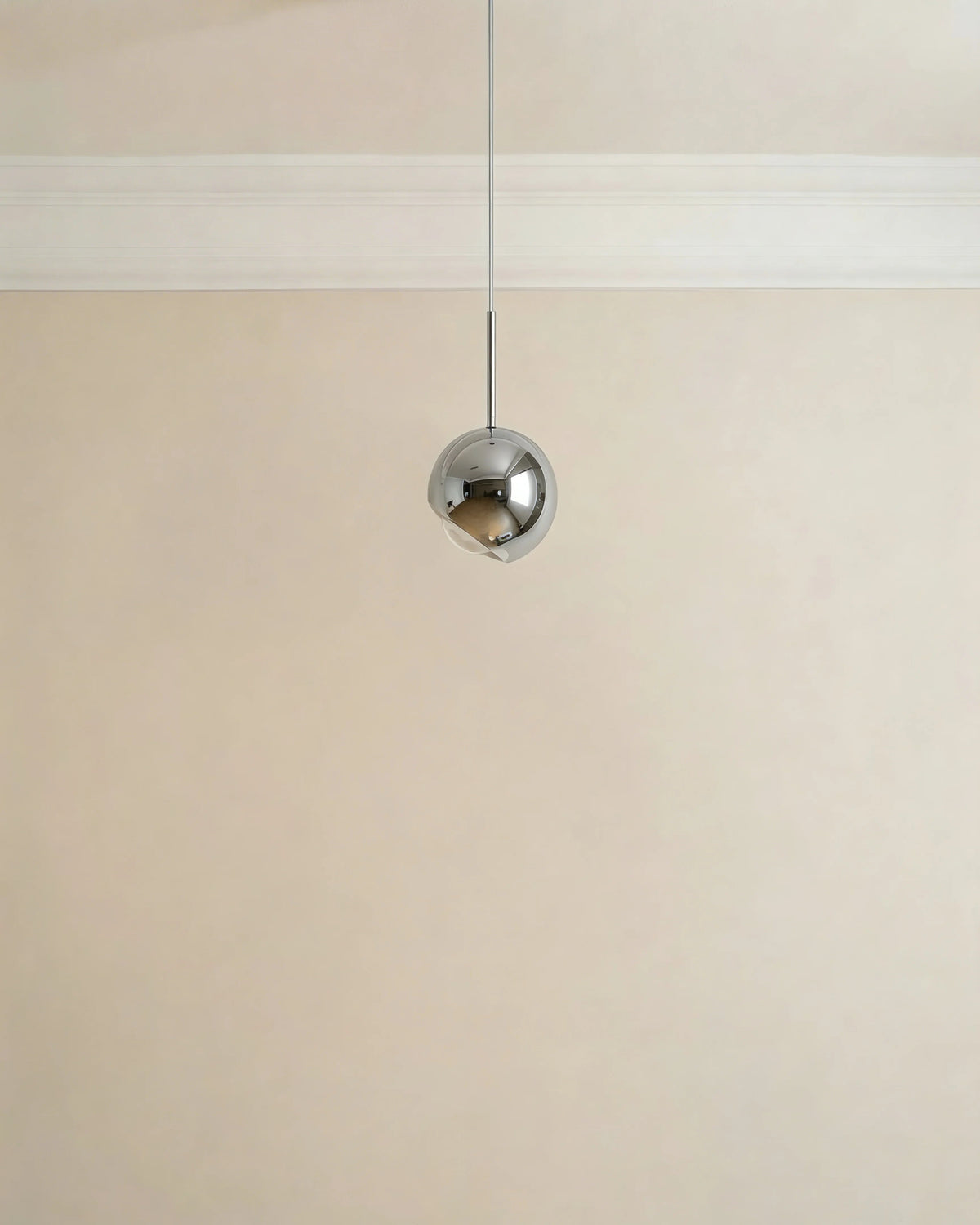 Silver pendant light over a Dubai kitchen island