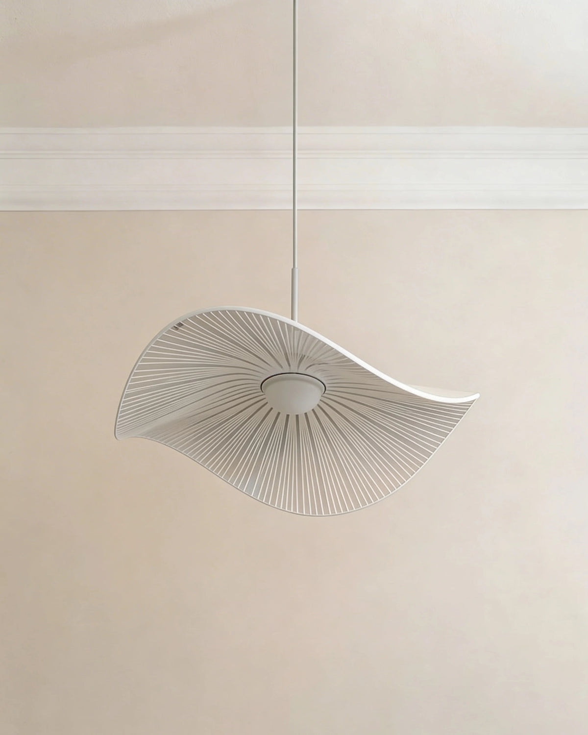 Sculptural wave ceiling lamp in a Dubai dining room