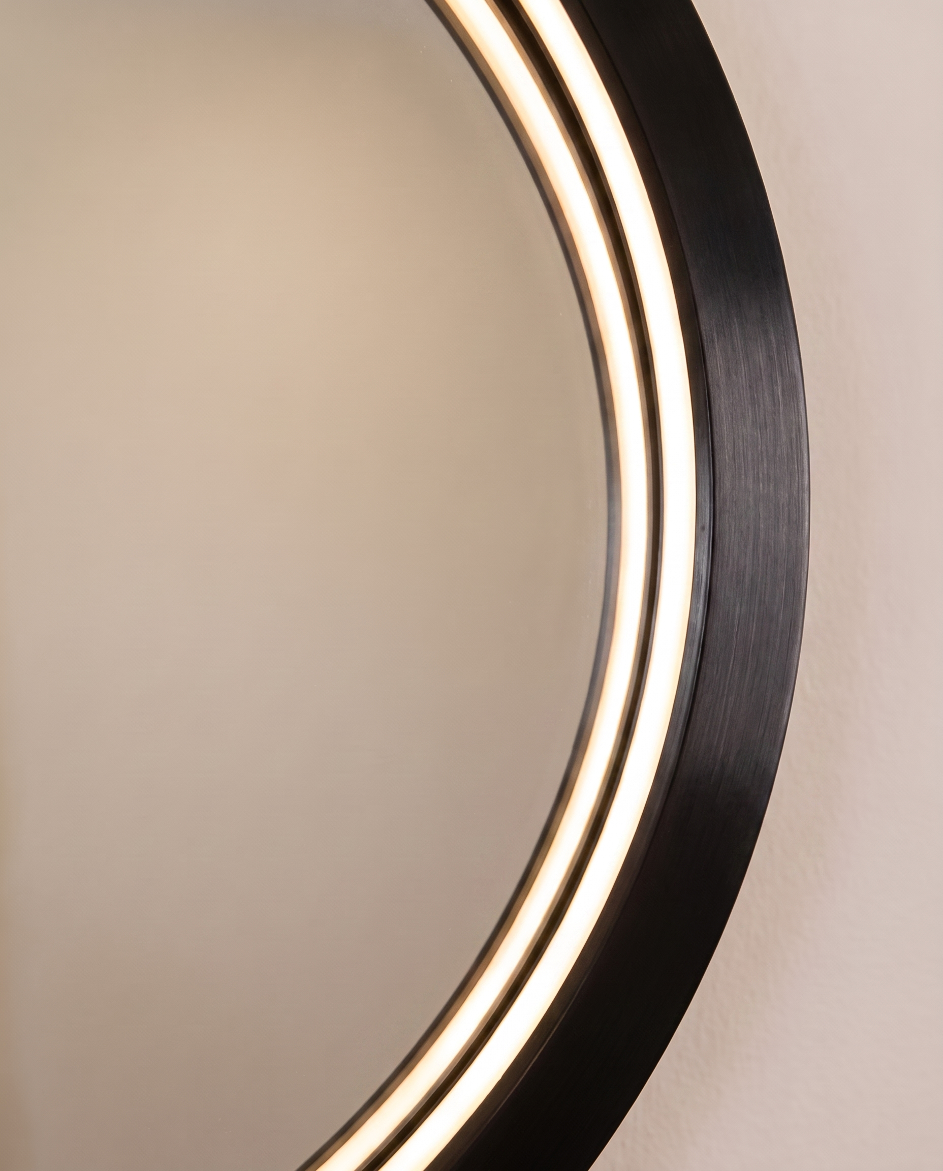 Callis black round LED wall mirror in a Dubai bathroom