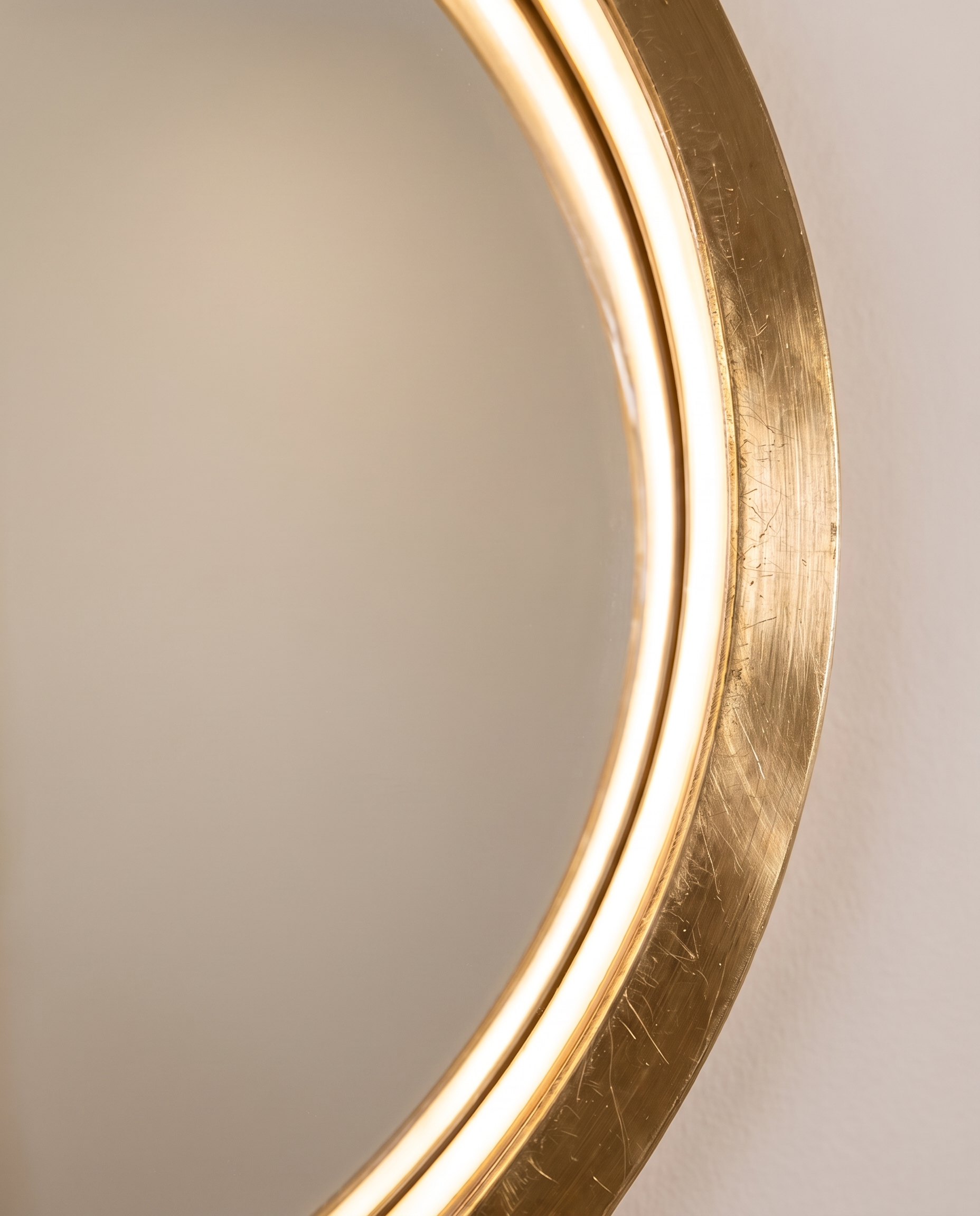 Callis gold round LED wall mirror in a Dubai bathroom