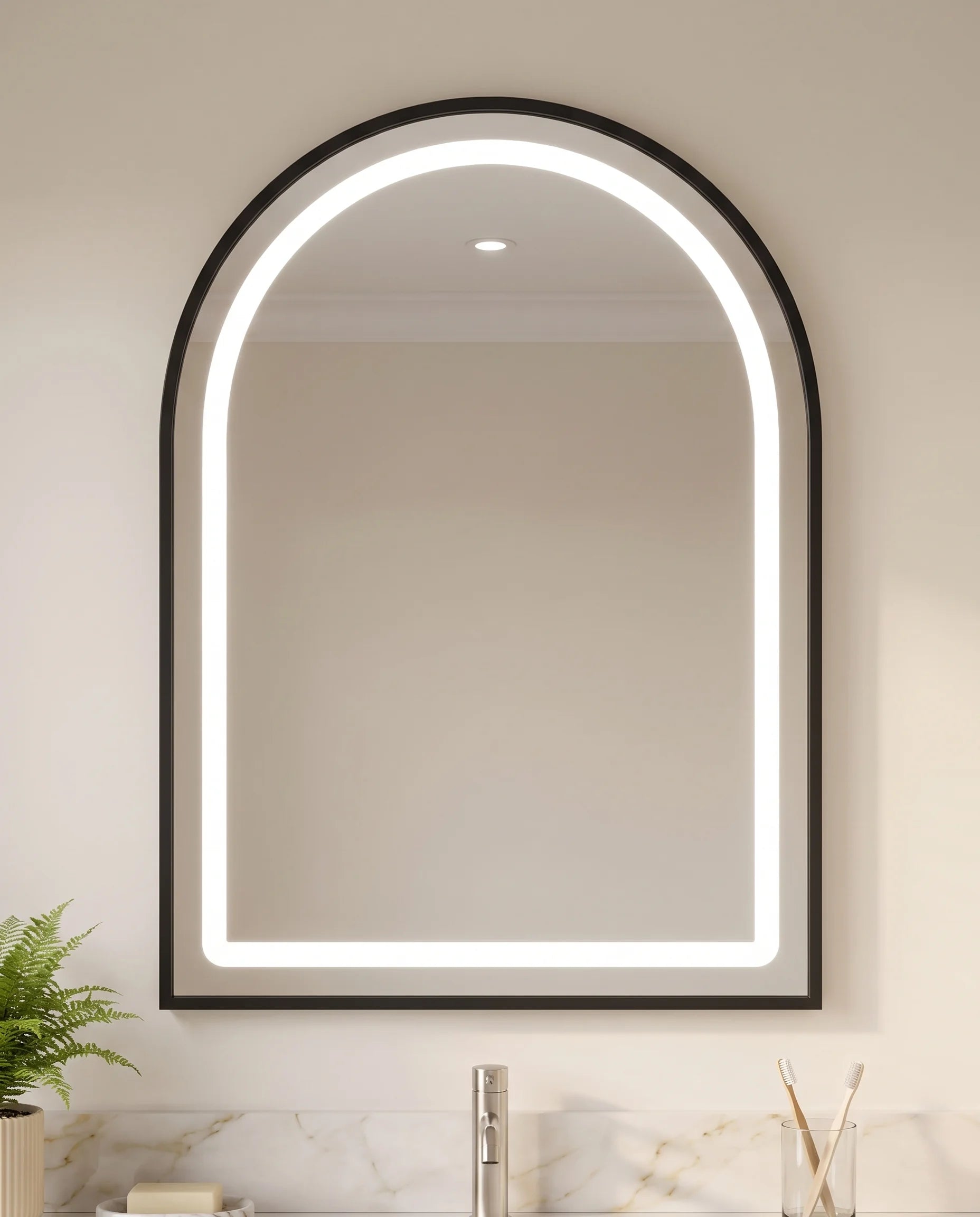 Deluxe black framed arch vanity mirror in a Dubai bathroom