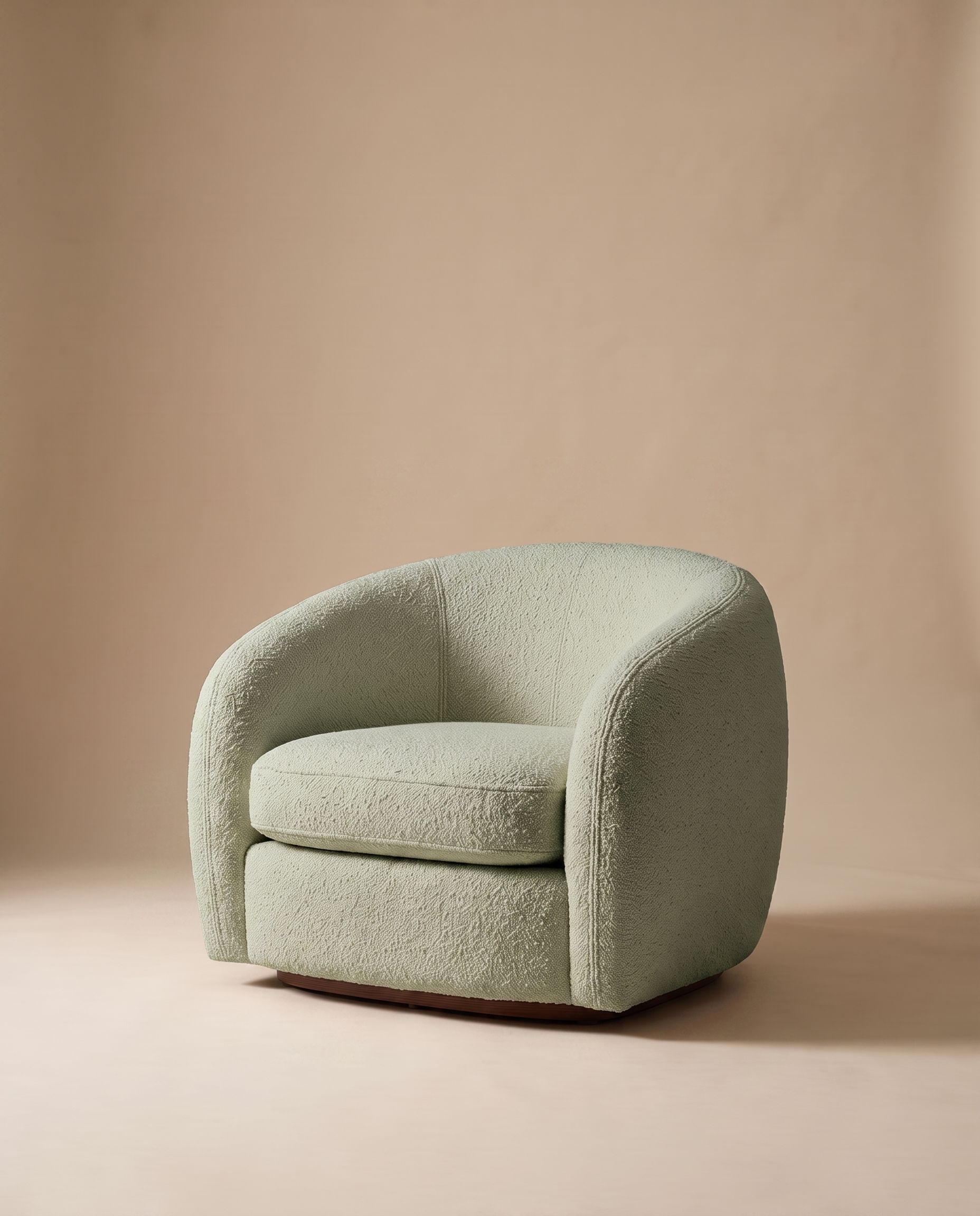 Elise green bouclé curved armchair on a warm oat studio backdrop