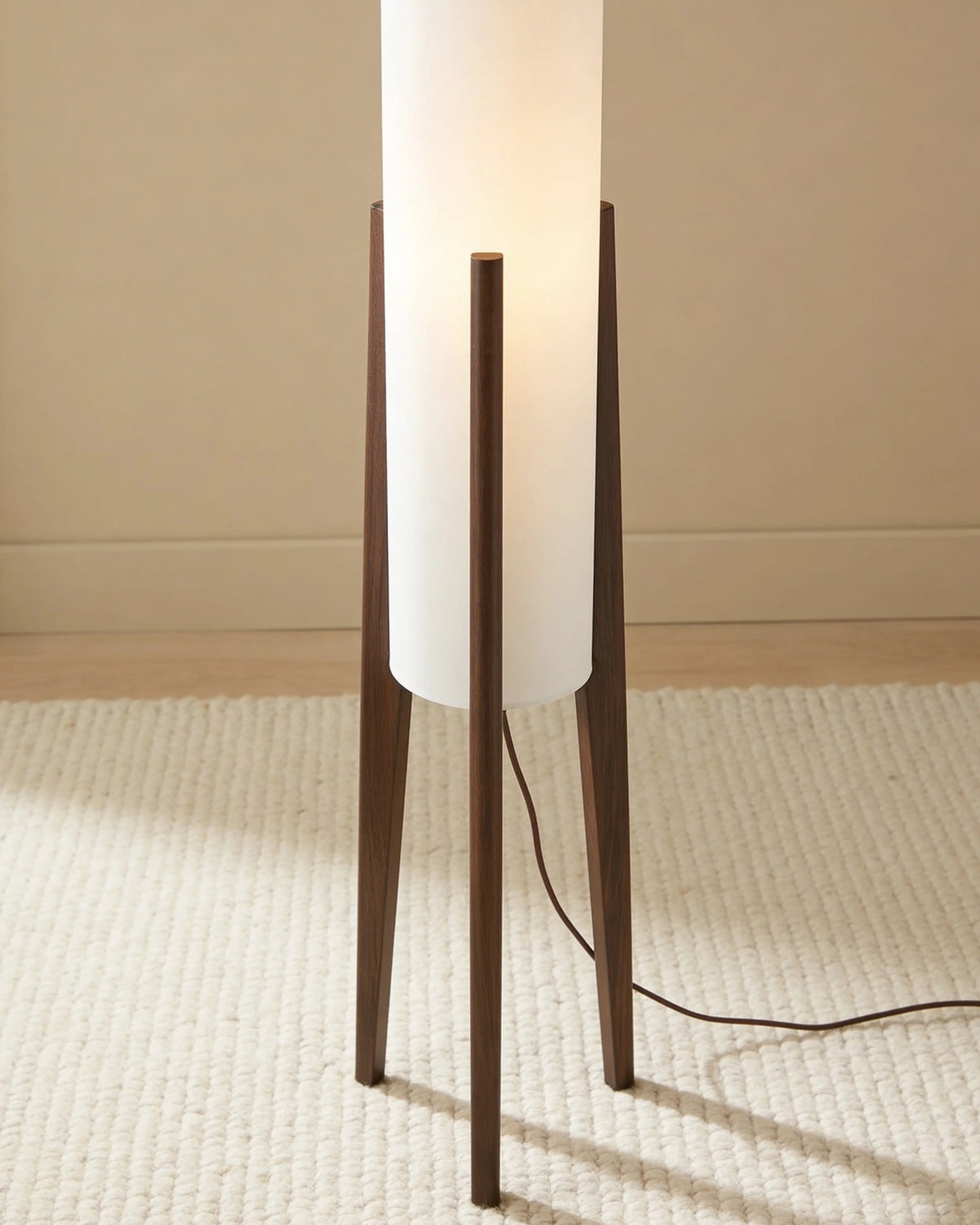 Odette walnut tripod floor lamp with glass cylinder, close-up detail