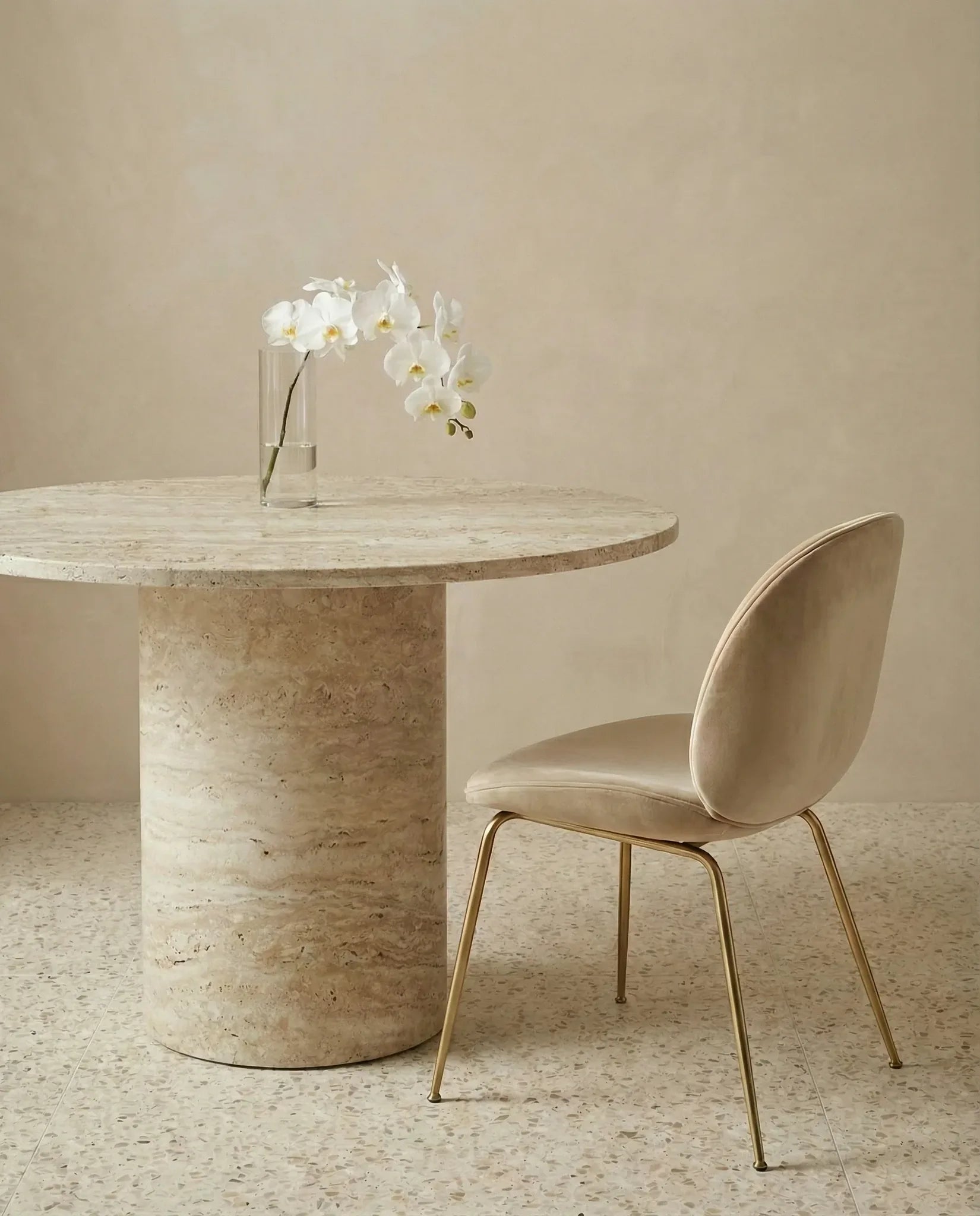 Sinclair round travertine dining table