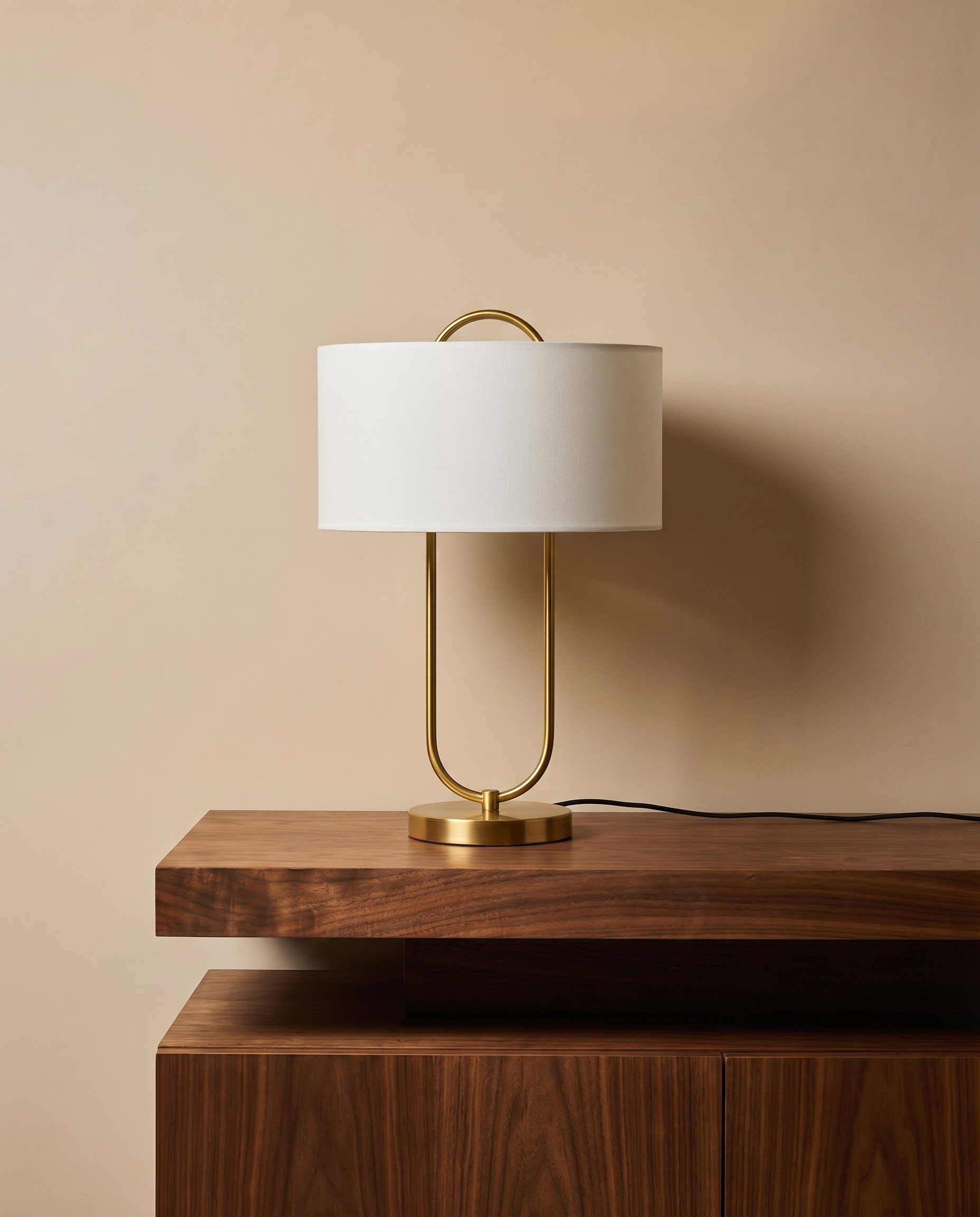 Gold table lamp with off-white fabric shade