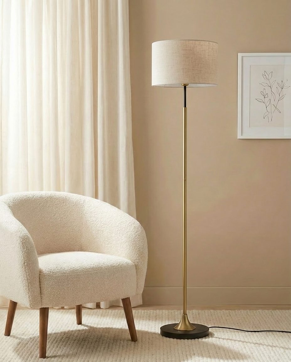 Gold and black floor lamp with off-white shade