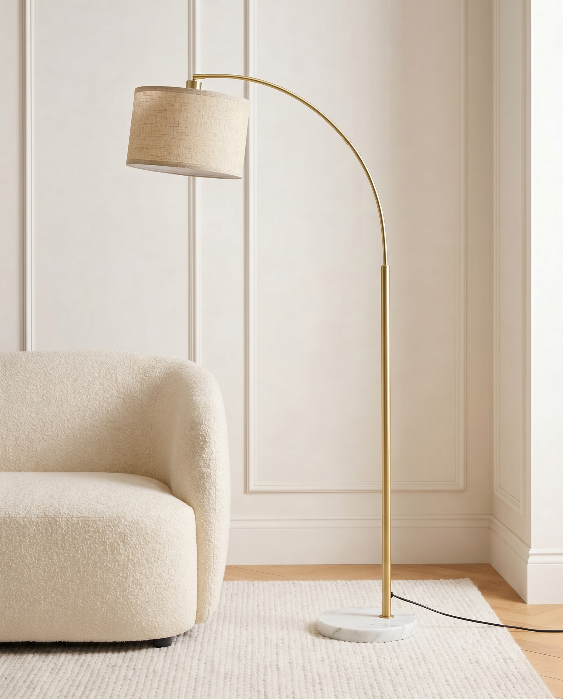Gold floor lamp with off-white fabric shade