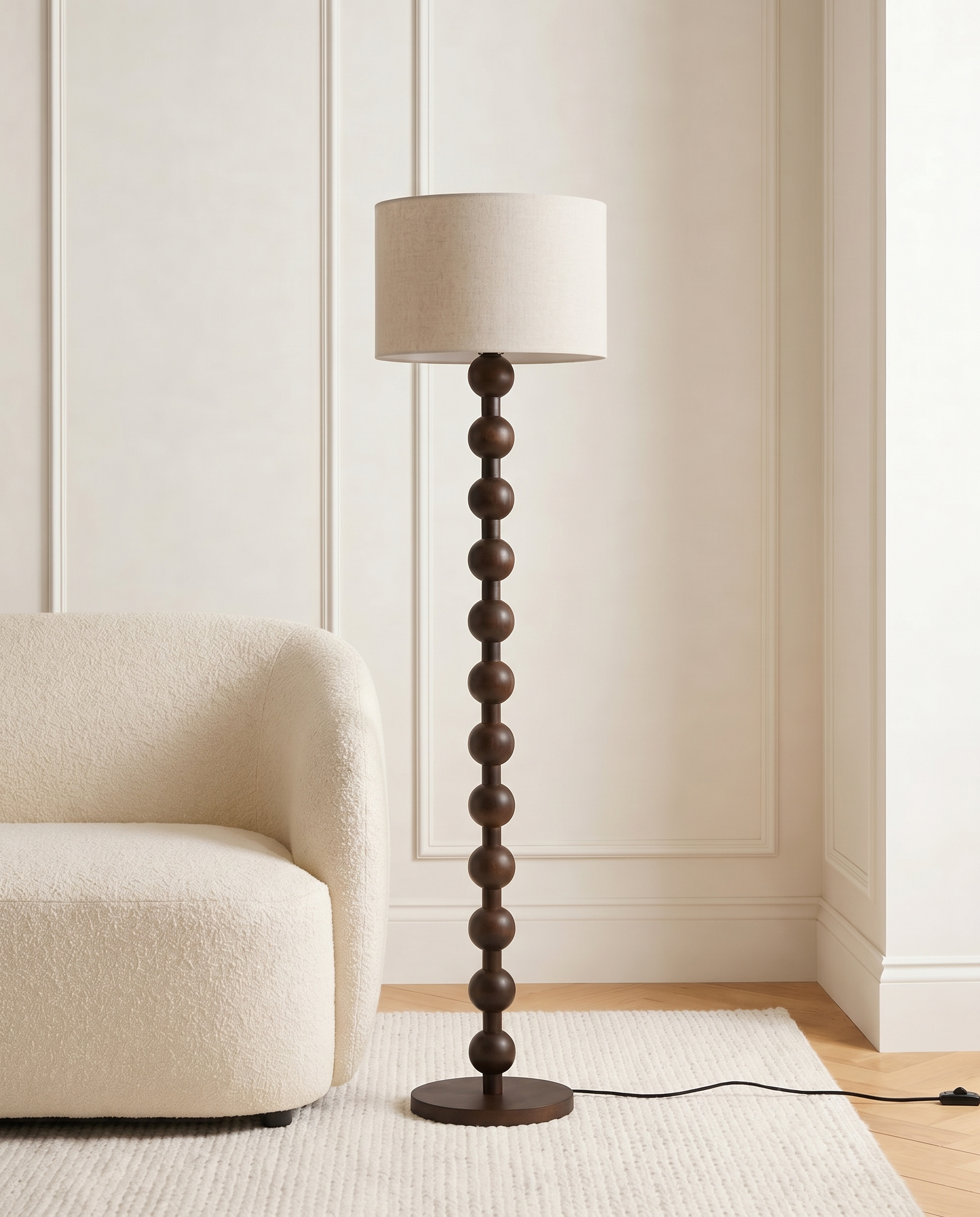 Dark wood floor lamp with off-white fabric shade
